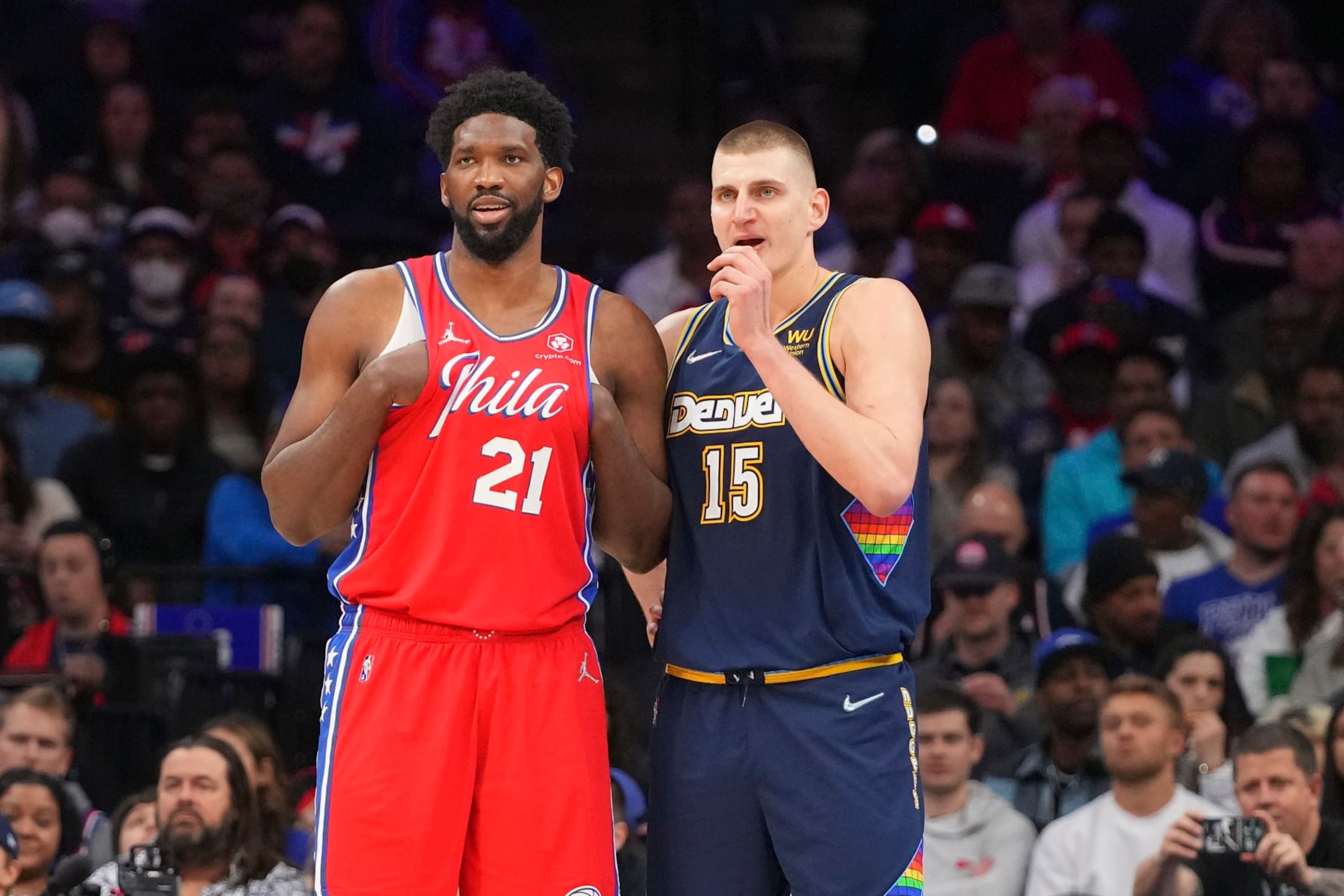 PHILADELPHIA, PA - MARCH 14: Joel Embiid #21 of the Philadelphia 76ers talks to Nikola Jokic #15 of the Denver Nuggets at the Wells Fargo Center on March 14, 2022 in Philadelphia, Pennsylvania. The Nuggets defeated the 76ers 114-110. NOTE TO USER: User expressly acknowledges and agrees that, by downloading and or using this photograph, User is consenting to the terms and conditions of the Getty Images License Agreement. (Photo by Mitchell Leff/Getty Images)