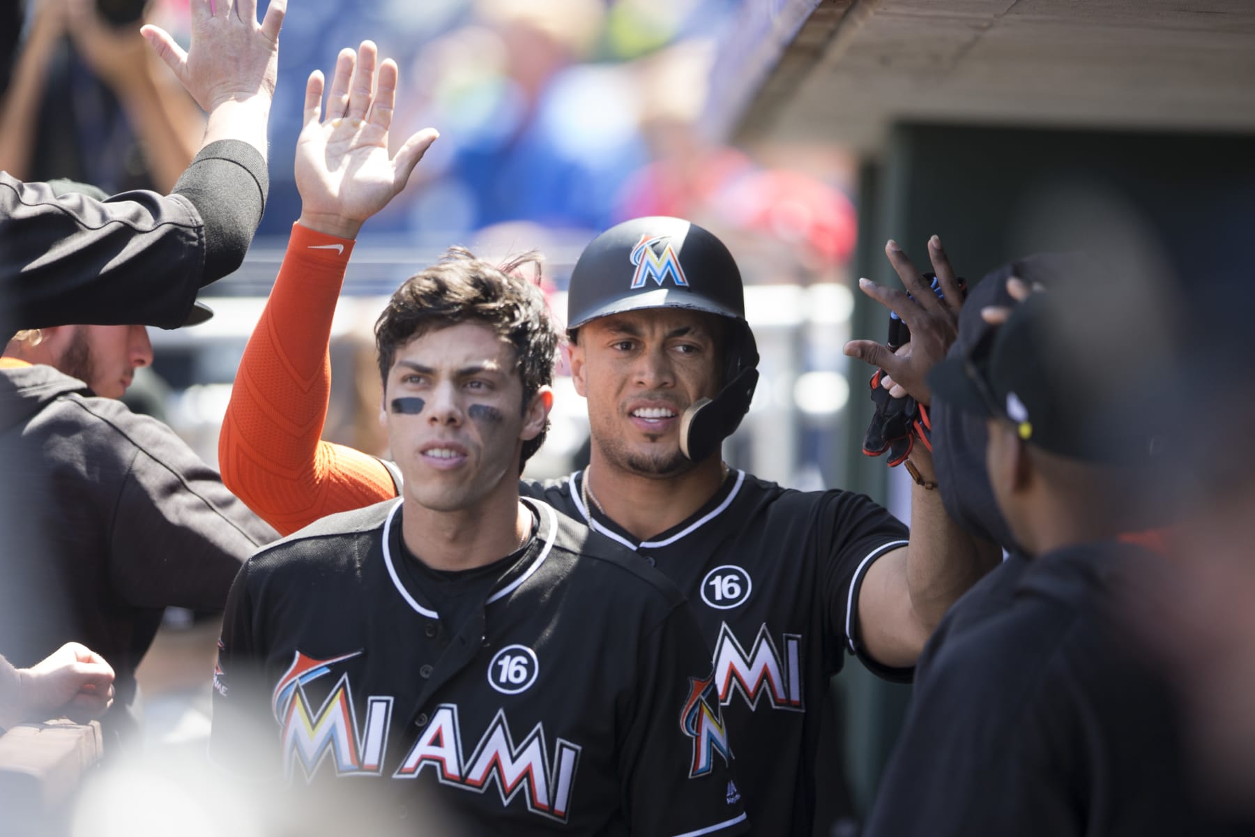 PHILADELPHIA, PA - AUGUST 24: Christian Yelich #21 and Giancarlo Stanton #27 of the Miami Marlins celebrate in the dugout against the Philadelphia Phillies at Citizens Bank Park on August 24, 2017 in Philadelphia, Pennsylvania. (Photo by Mitchell Leff/Getty Images)