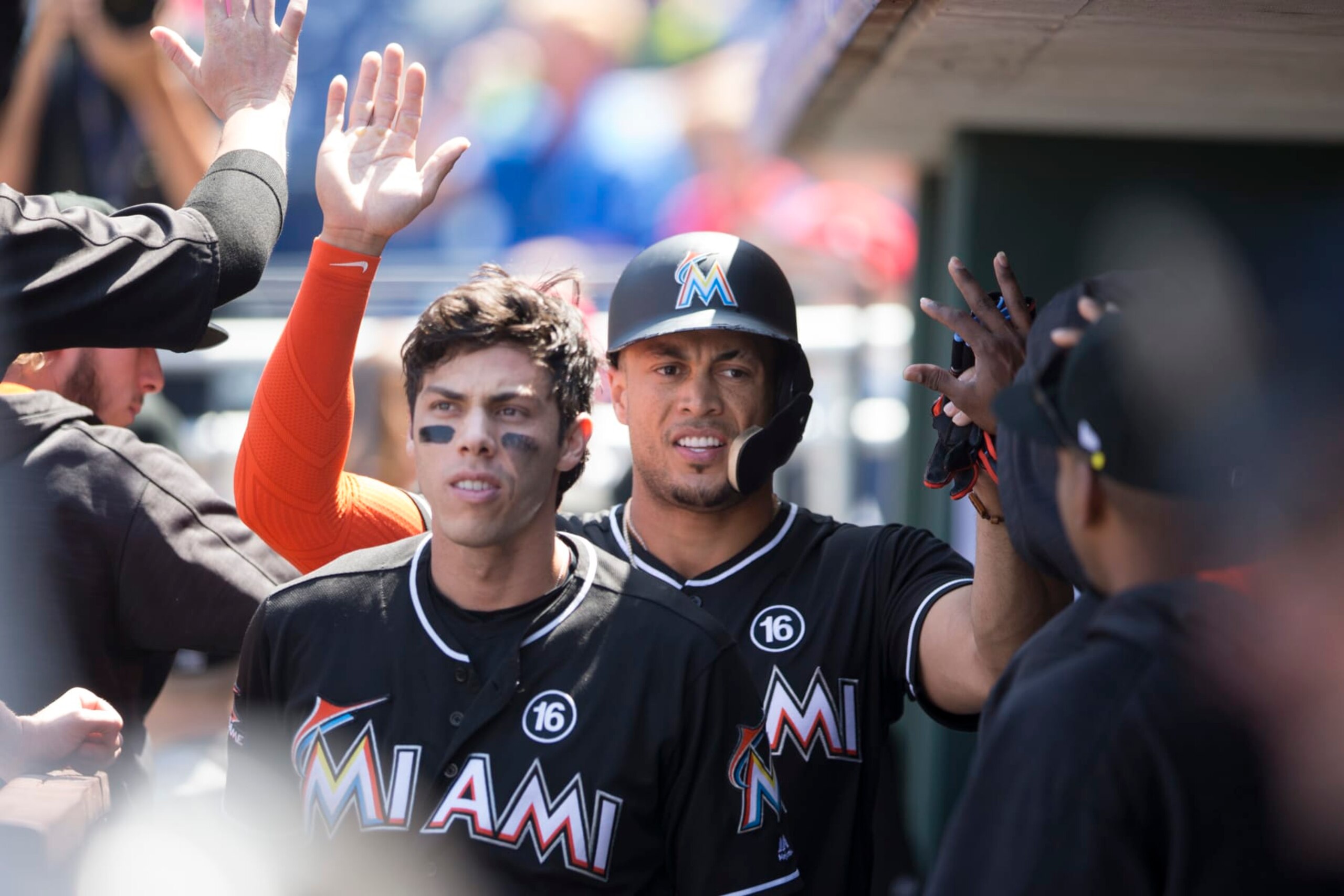 PHILADELPHIA, PA - AUGUST 24: Christian Yelich #21 and Giancarlo Stanton #27 of the Miami Marlins celebrate in the dugout against the Philadelphia Phillies at Citizens Bank Park on August 24, 2017 in Philadelphia, Pennsylvania. (Photo by Mitchell Leff/Getty Images)