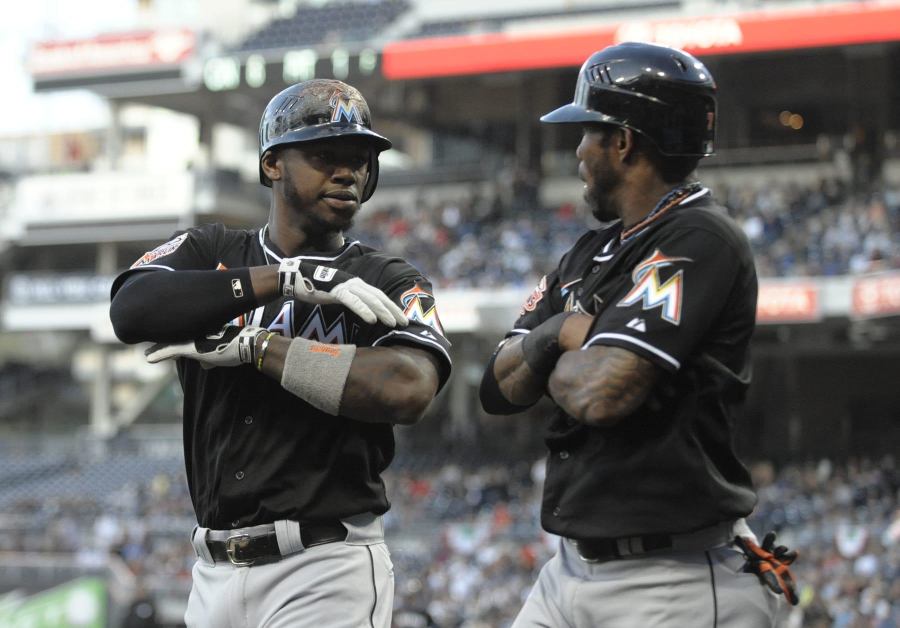 SAN DIEGO, CA - MAY 4: Hanley Ramirez #2 of the Miami Marlins, left, is congratulated by Jose Reyes #7  after hitting a three-run homer during the first inning of a baseball game against the San Diego Padres at Petco Park on May 4, 2012 in San Diego, California.  (Photo by Denis Poroy/Getty Images)
