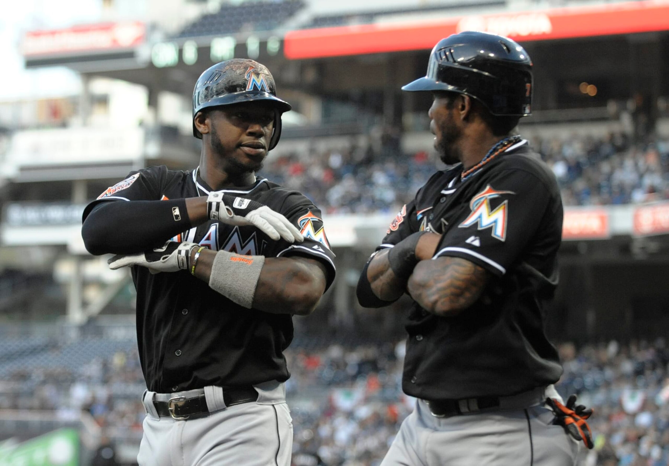 SAN DIEGO, CA - MAY 4: Hanley Ramirez #2 of the Miami Marlins, left, is congratulated by Jose Reyes #7  after hitting a three-run homer during the first inning of a baseball game against the San Diego Padres at Petco Park on May 4, 2012 in San Diego, California.  (Photo by Denis Poroy/Getty Images)