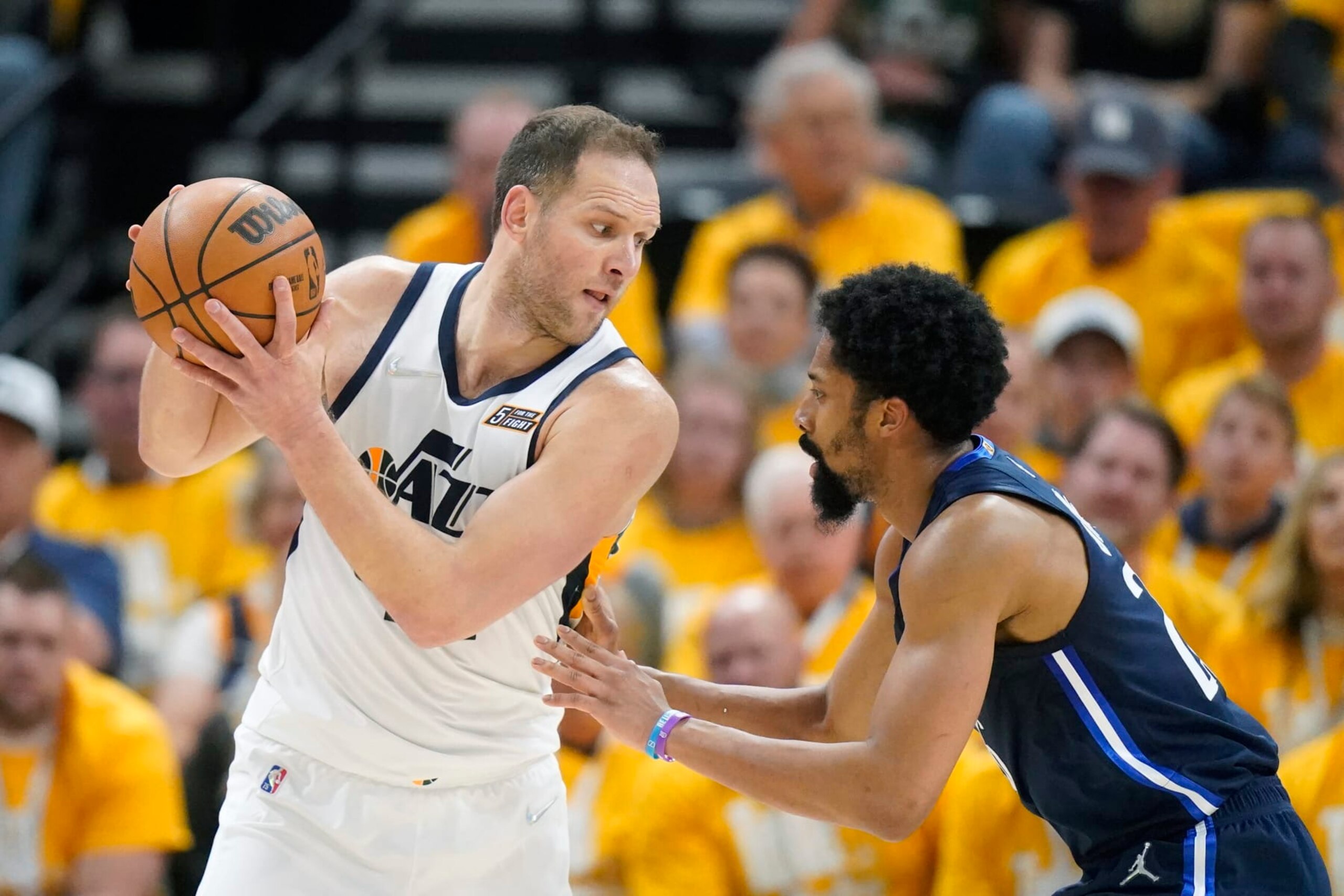 Dallas Mavericks guard Spencer Dinwiddie, right, guards Utah Jazz forward Bojan Bogdanovic, left, in the first half of Game 4 of an NBA basketball first-round playoff series, Saturday, April 23, 2022, in Salt Lake City. (AP Photo/Rick Bowmer)