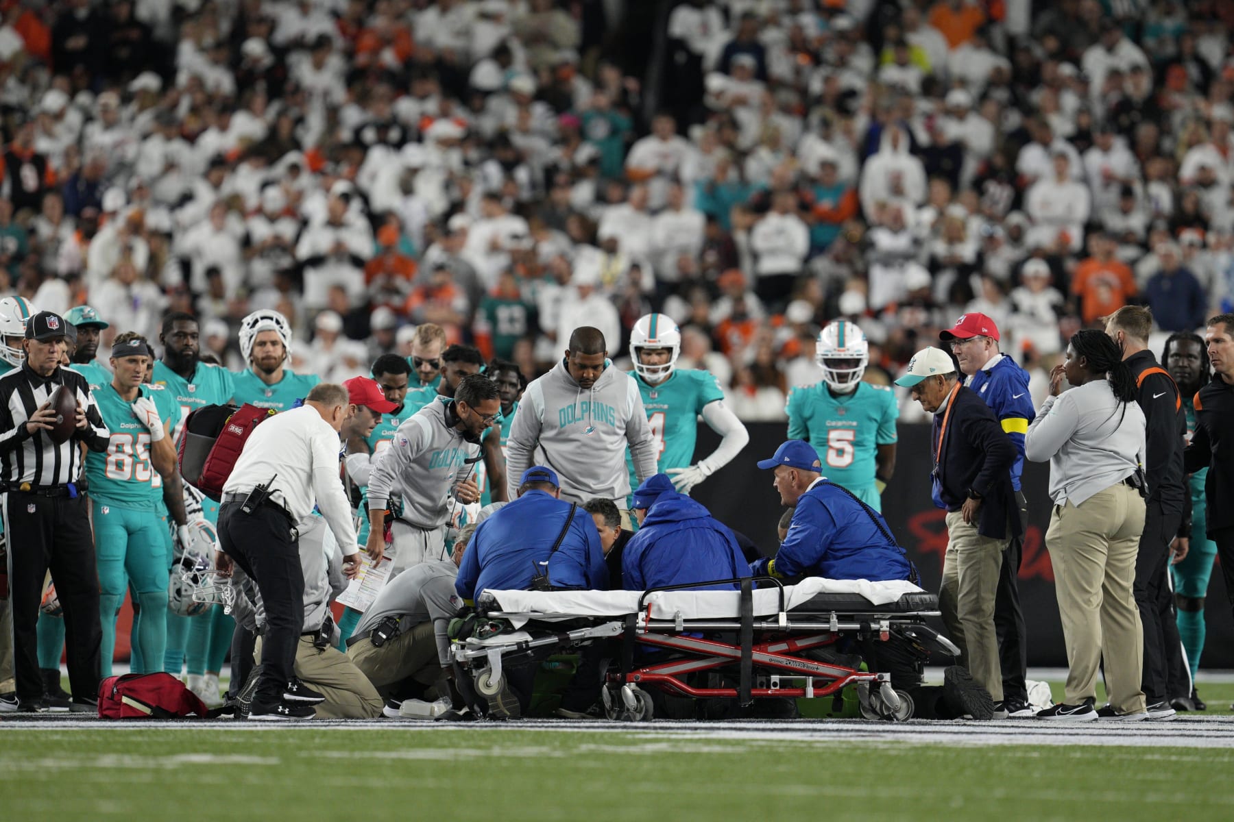 Miami Dolphins quarterback Tua Tagovailoa is examined during the first half of an NFL football game against the Cincinnati Bengals, Thursday, Sept. 29, 2022, in Cincinnati. (AP Photo/Jeff Dean)