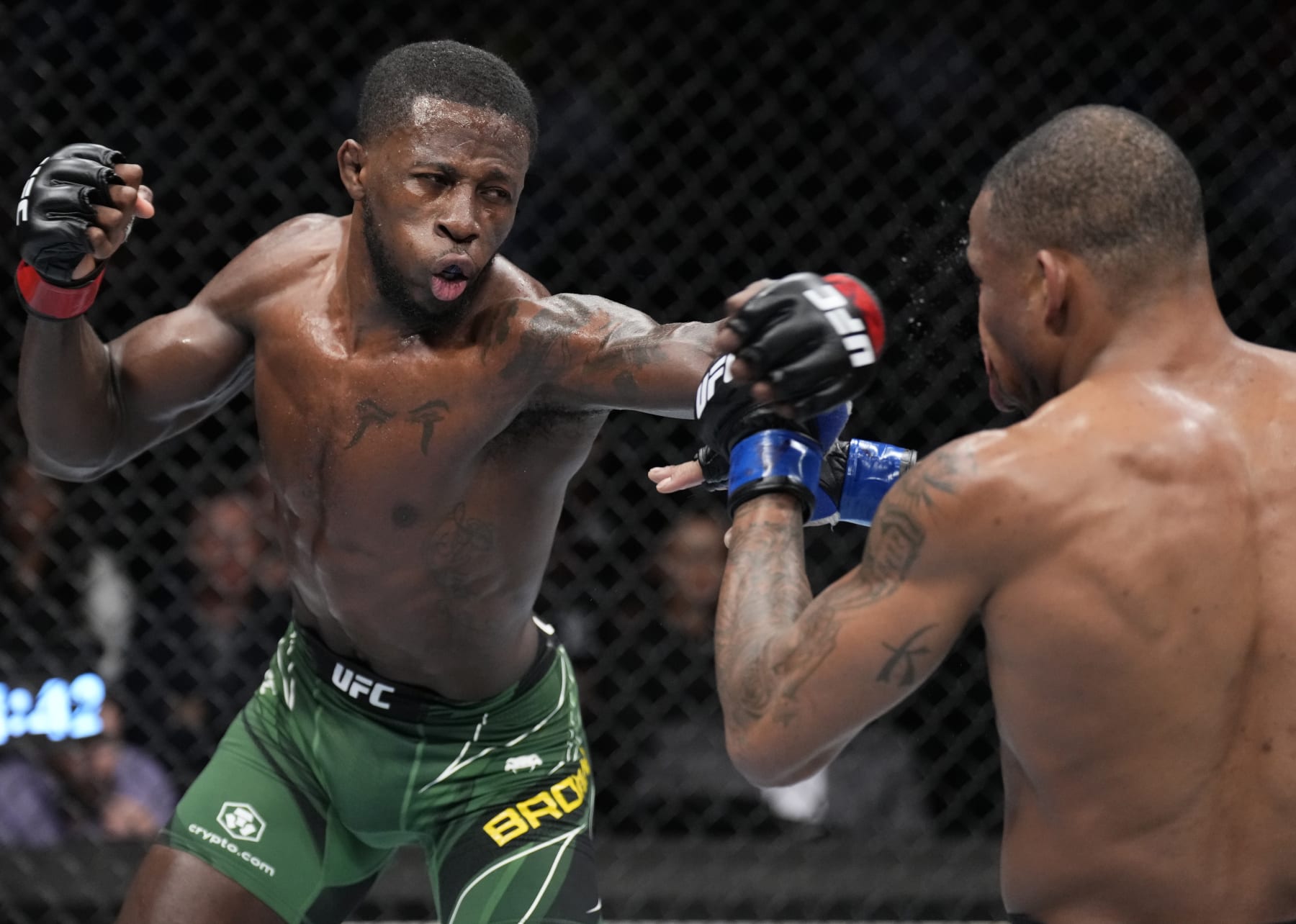 PHOENIX, ARIZONA - MAY 07: (L-R) Randy Brown of Jamaica punches Khaos Williams in a welterweight fight during the UFC 274 event at Footprint Center on May 07, 2022 in Phoenix, Arizona. (Photo by Chris Unger/Zuffa LLC)