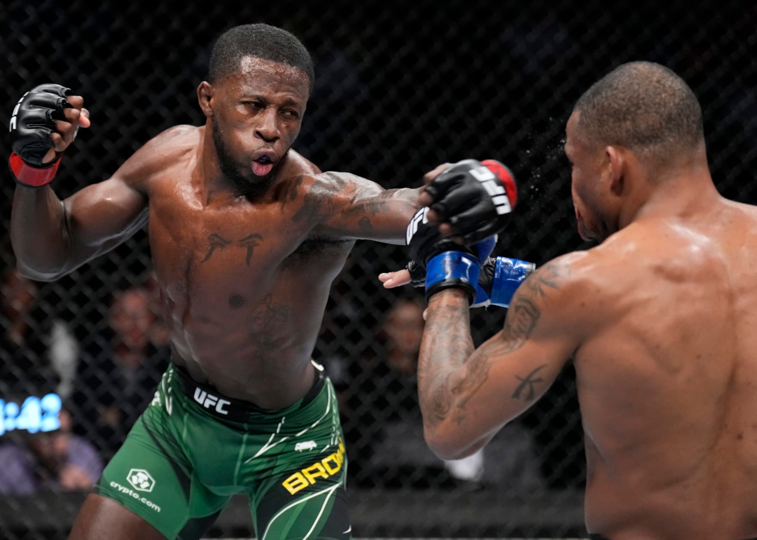 PHOENIX, ARIZONA - MAY 07: (L-R) Randy Brown of Jamaica punches Khaos Williams in a welterweight fight during the UFC 274 event at Footprint Center on May 07, 2022 in Phoenix, Arizona. (Photo by Chris Unger/Zuffa LLC)