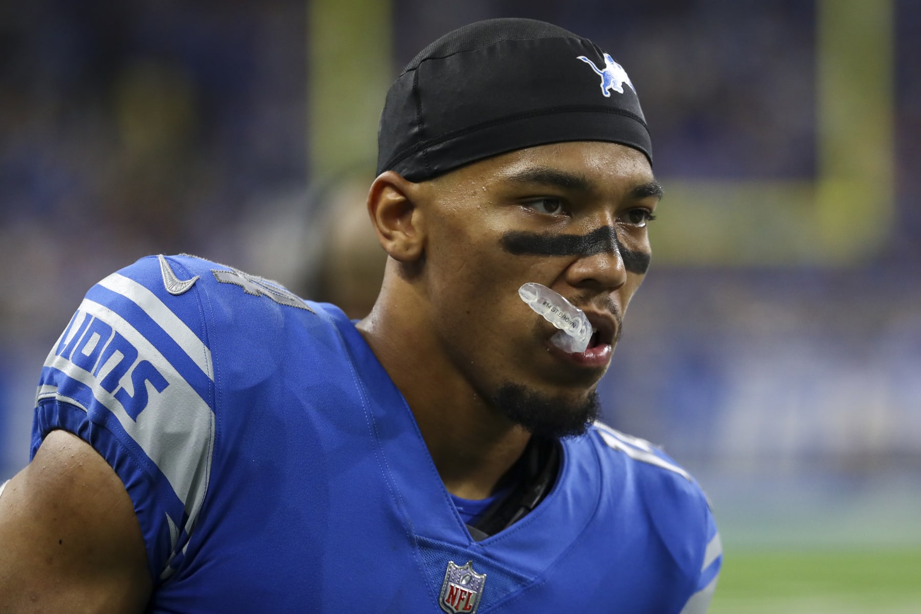 DETROIT, MI - SEPTEMBER 18: Amon-Ra St. Brown #14 of the Detroit Lions looks on during an NFL football game against the Washington Commanders at Ford Field on September 18, 2022 in Detroit, Michigan. (Photo by Kevin Sabitus/Getty Images)