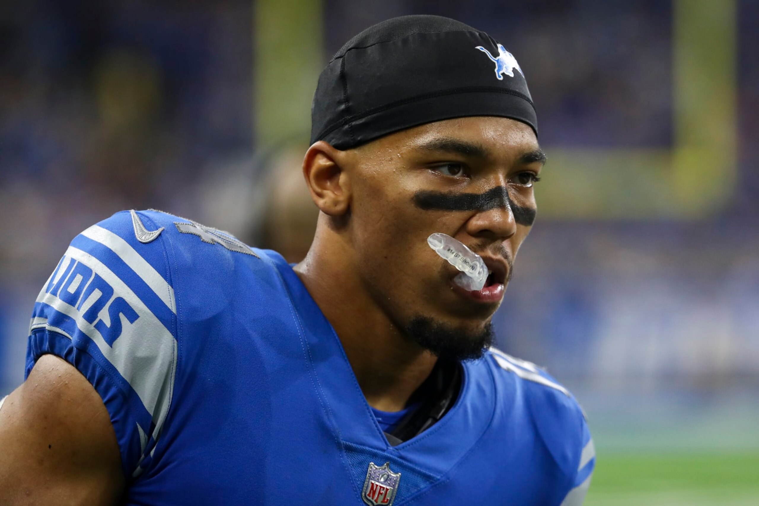 DETROIT, MI - SEPTEMBER 18: Amon-Ra St. Brown #14 of the Detroit Lions looks on during an NFL football game against the Washington Commanders at Ford Field on September 18, 2022 in Detroit, Michigan. (Photo by Kevin Sabitus/Getty Images)