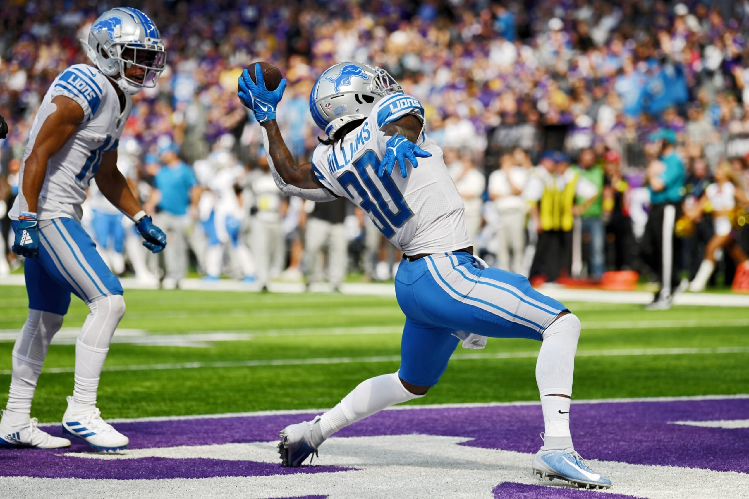 MINNEAPOLIS, MINNESOTA - SEPTEMBER 25: Running back Jamaal Williams #30 of the Detroit Lions celebrates after scoring a touchdown in the first quarter of the game against the Minnesota Vikings at U.S. Bank Stadium on September 25, 2022 in Minneapolis, Minnesota. (Photo by Stephen Maturen/Getty Images)