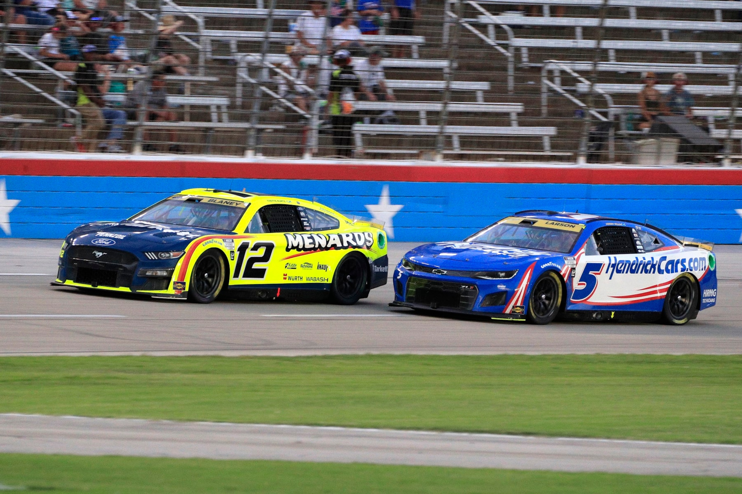 FORT WORTH, TX - SEPTEMBER 25: Kyle Larson (#5 Hendrick Motorsports HendrickCars.com Chevrolet) pressures Ryan Blaney (#12 Team Penske Menards/Tarkett Ford) during the NASCAR Cup Series Playoff Autotrader EchoPark Automotive 500 race on September 25, 2022 at the Texas Motor Speedway in Fort Worth, Texas. (Photo by David J. Griffin/Icon Sportswire via Getty Images) FORT WORTH, TX - SEPTEMBER 25: Kyle Larson (#5 Hendrick Motorsports HendrickCars.com Chevrolet) pressures Ryan Blaney (#12 Team Penske Menards/Tarkett Ford) during the NASCAR Cup Series Playoff Autotrader EchoPark Automotive 500 race on September 25, 2022 at the Texas Motor Speedway in Fort Worth, Texas. (Photo by David J. Griffin/Icon Sportswire via Getty Images)