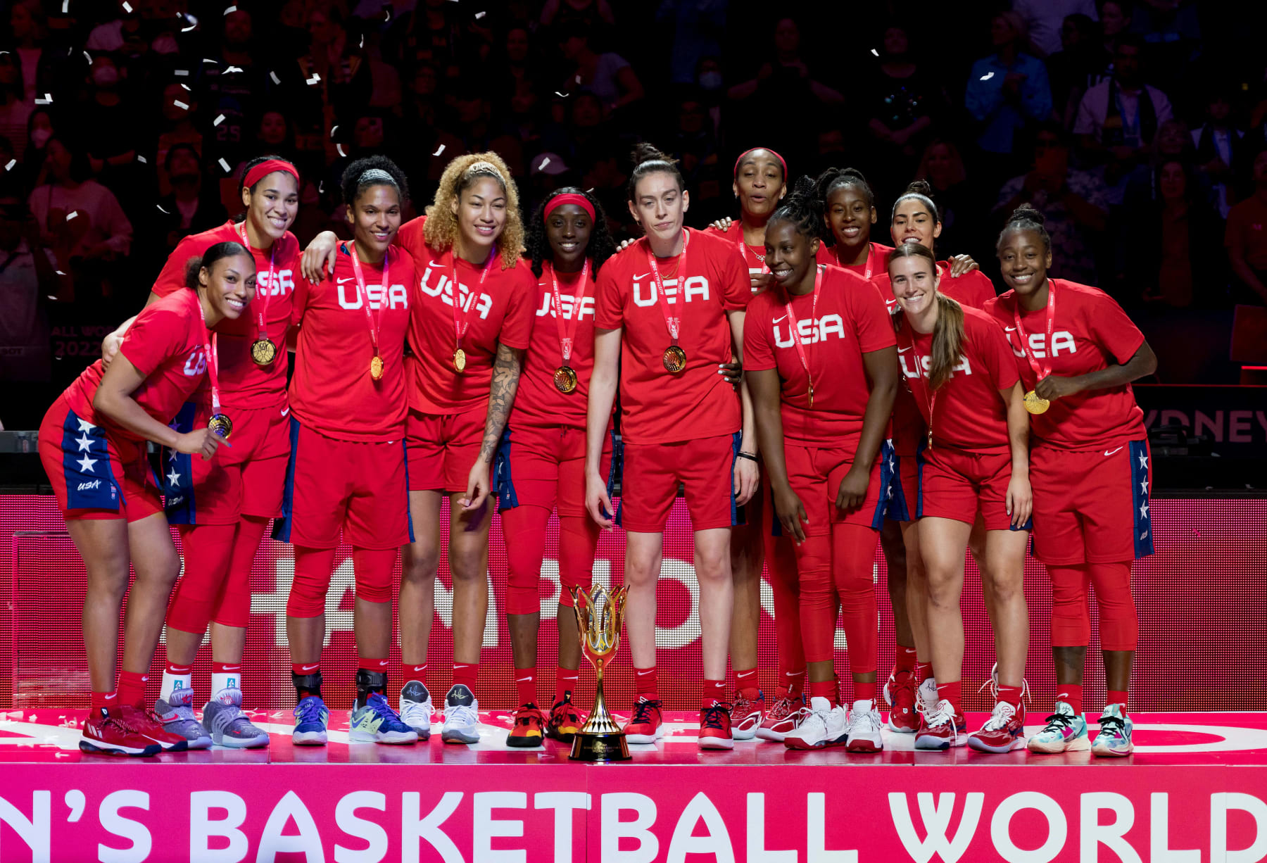 Team USA celebrate with the trophy after the 2022 FIBA Women's Basketball World Cup final match between China and the USA at the Superdome on October 1, 2022, in Sydney. - --IMAGE RESTRICTED TO EDITORIAL USE - NO COMMERCIAL USE-- (Photo by Andy Cheung / AFP) / --IMAGE RESTRICTED TO EDITORIAL USE - NO COMMERCIAL USE-- (Photo by ANDY CHEUNG/AFP via Getty Images)