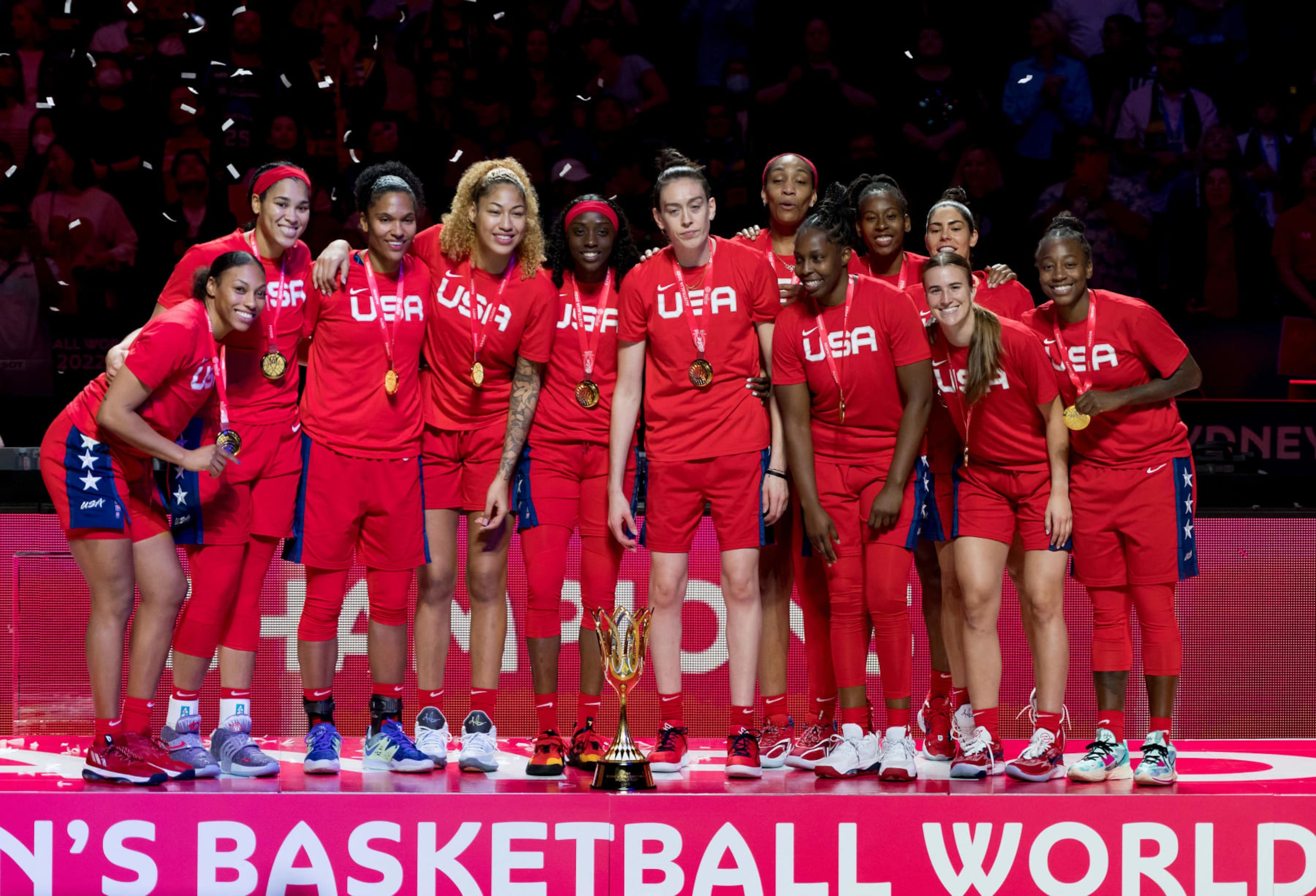 Team USA celebrate with the trophy after the 2022 FIBA Women's Basketball World Cup final match between China and the USA at the Superdome on October 1, 2022, in Sydney. - --IMAGE RESTRICTED TO EDITORIAL USE - NO COMMERCIAL USE-- (Photo by Andy Cheung / AFP) / --IMAGE RESTRICTED TO EDITORIAL USE - NO COMMERCIAL USE-- (Photo by ANDY CHEUNG/AFP via Getty Images)