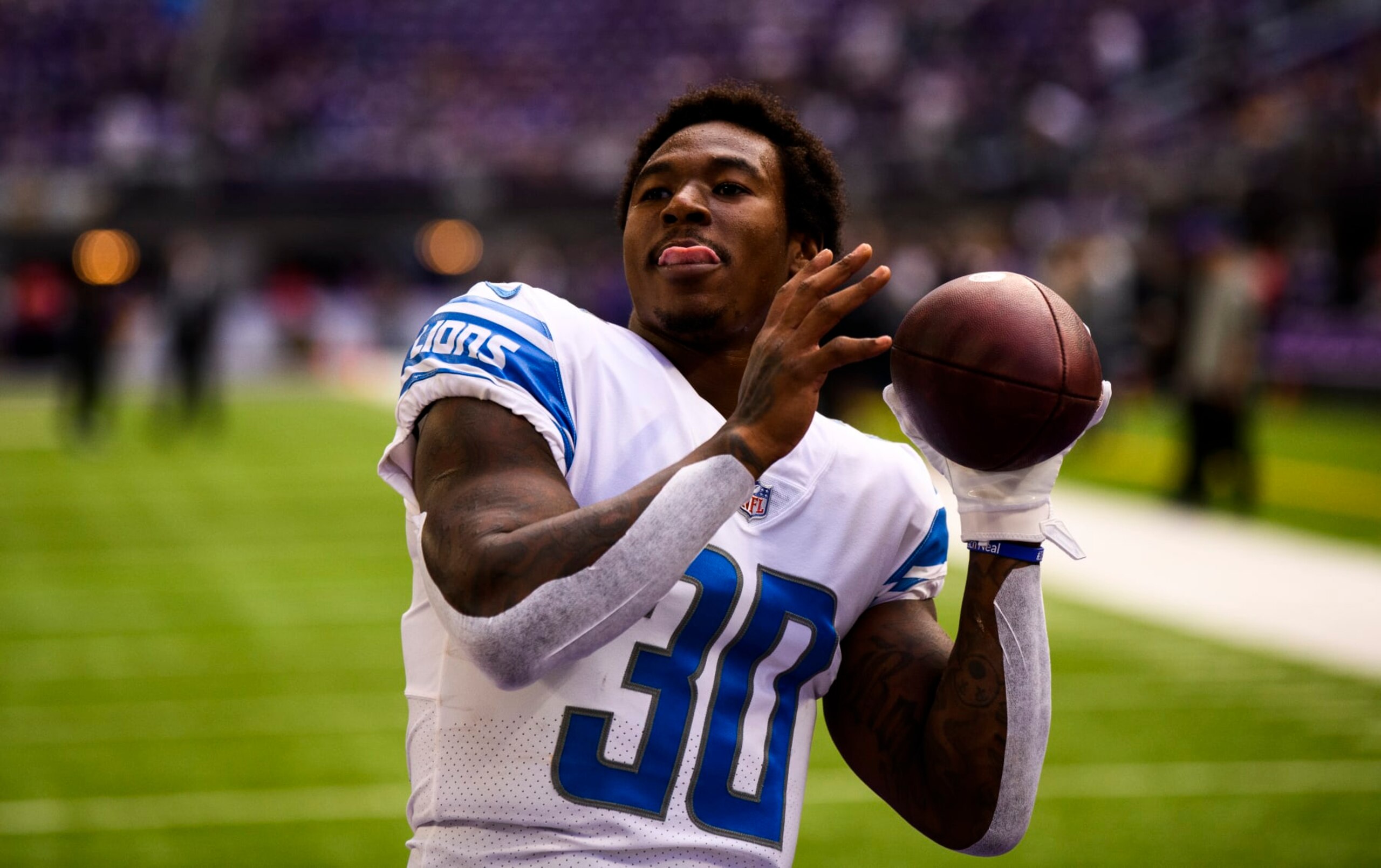 MINNEAPOLIS, MN - SEPTEMBER 25: Jamaal Williams #30 of the Detroit Lions warms up before the game against the Minnesota Vikings at U.S. Bank Stadium on September 25, 2022 in Minneapolis, Minnesota. (Photo by Stephen Maturen/Getty Images)