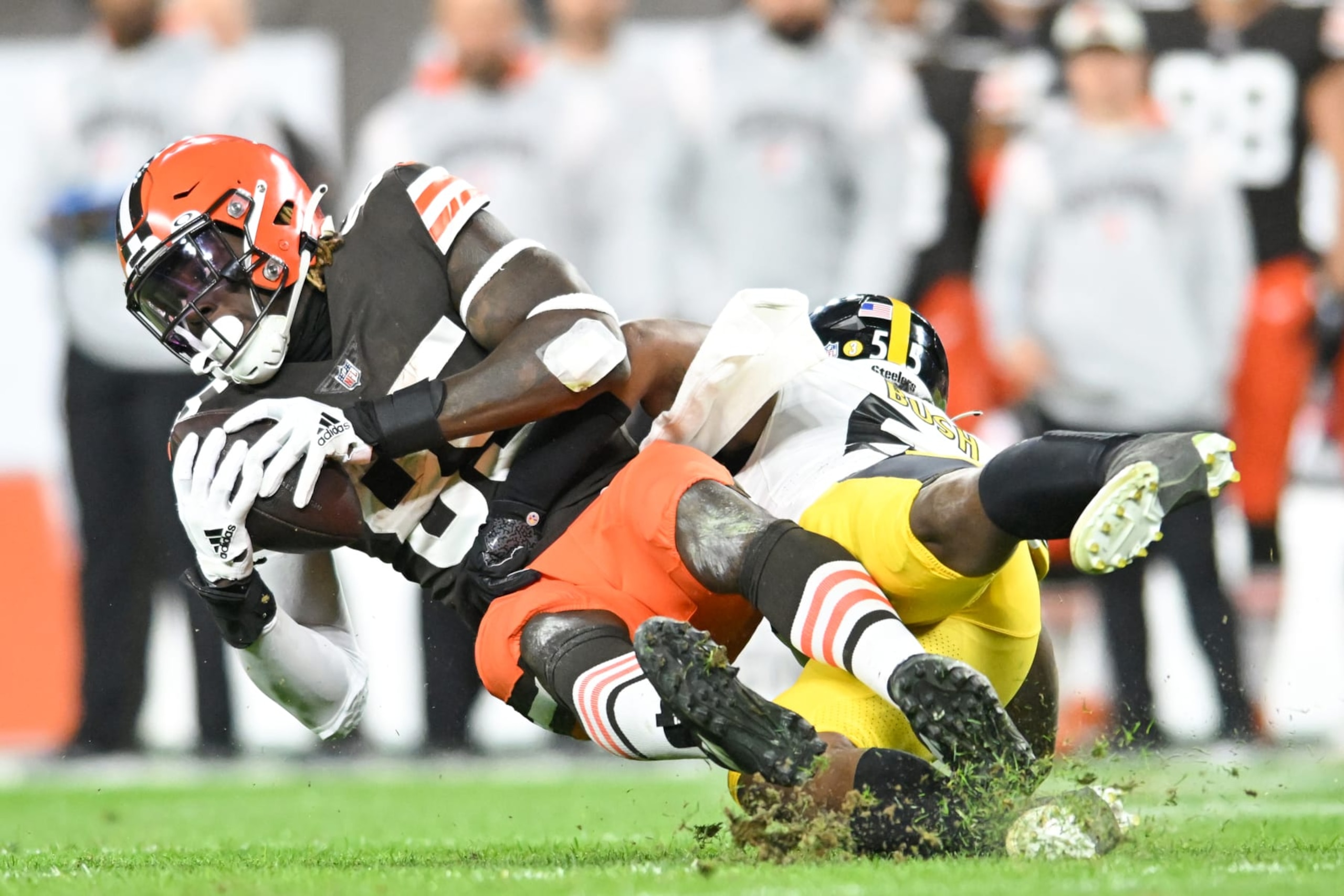CLEVELAND, OH - SEPTEMBER 22: David Njoku #85 of the Cleveland Browns is tackled by Devin Bush #55 of the Pittsburgh Steelers during the first half at FirstEnergy Stadium on September 22, 2022 in Cleveland, Ohio. (Photo by Nick Cammett/Diamond Images via Getty Images)
