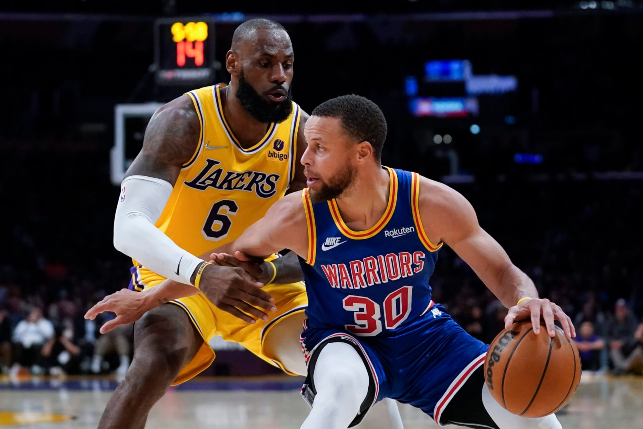 Los Angeles Lakers forward LeBron James (6) defends against Golden State Warriors guard Stephen Curry (30) during the second half of an NBA basketball game in Los Angeles, Saturday, March 5, 2022. (AP Photo/Ashley Landis) Los Angeles Lakers forward LeBron James (6) defends against Golden State Warriors guard Stephen Curry (30) during the second half of an NBA basketball game in Los Angeles, Saturday, March 5, 2022. (AP Photo/Ashley Landis)