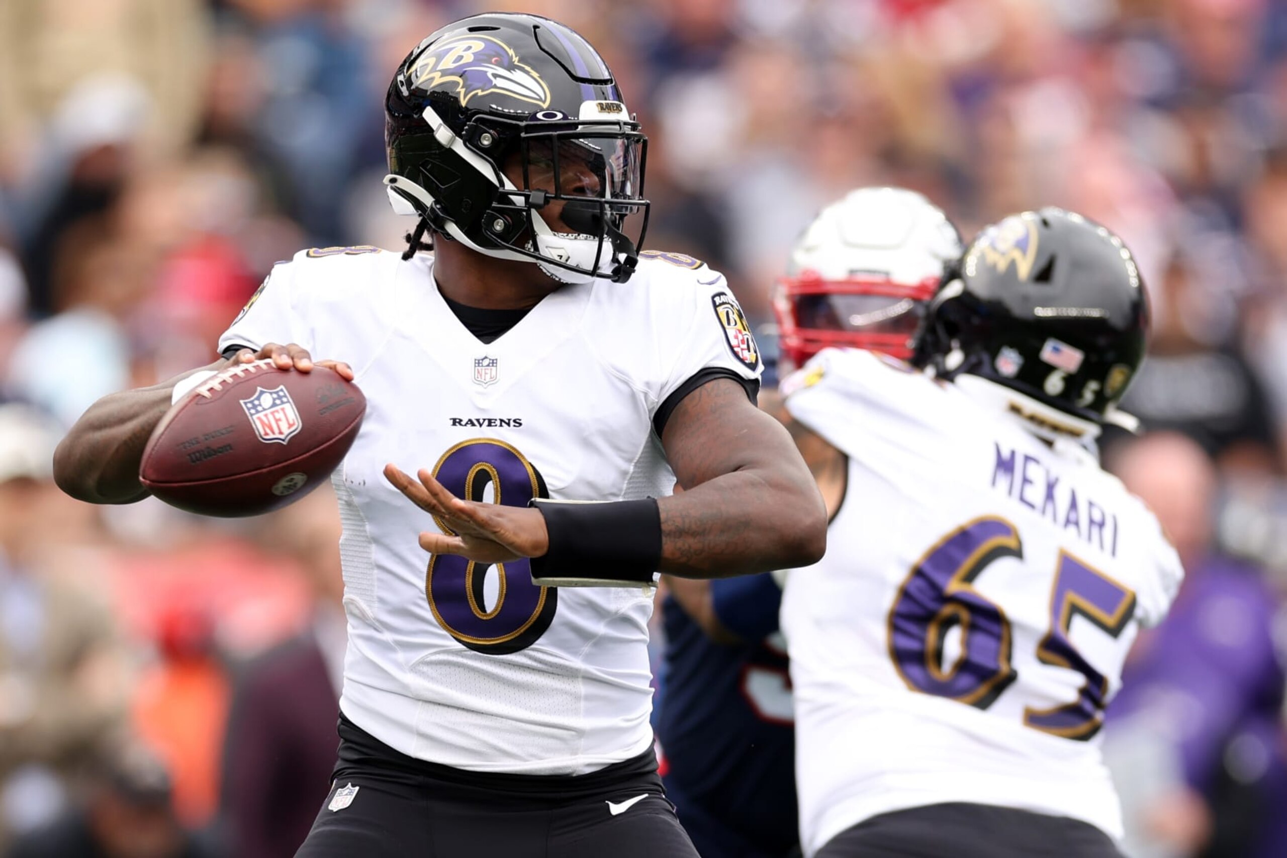 FOXBOROUGH, MASSACHUSETTS - SEPTEMBER 25: Lamar Jackson #8 of the Baltimore Ravens makes a pass against the New England Patriots at Gillette Stadium on September 25, 2022 in Foxborough, Massachusetts. (Photo by Maddie Meyer/Getty Images)