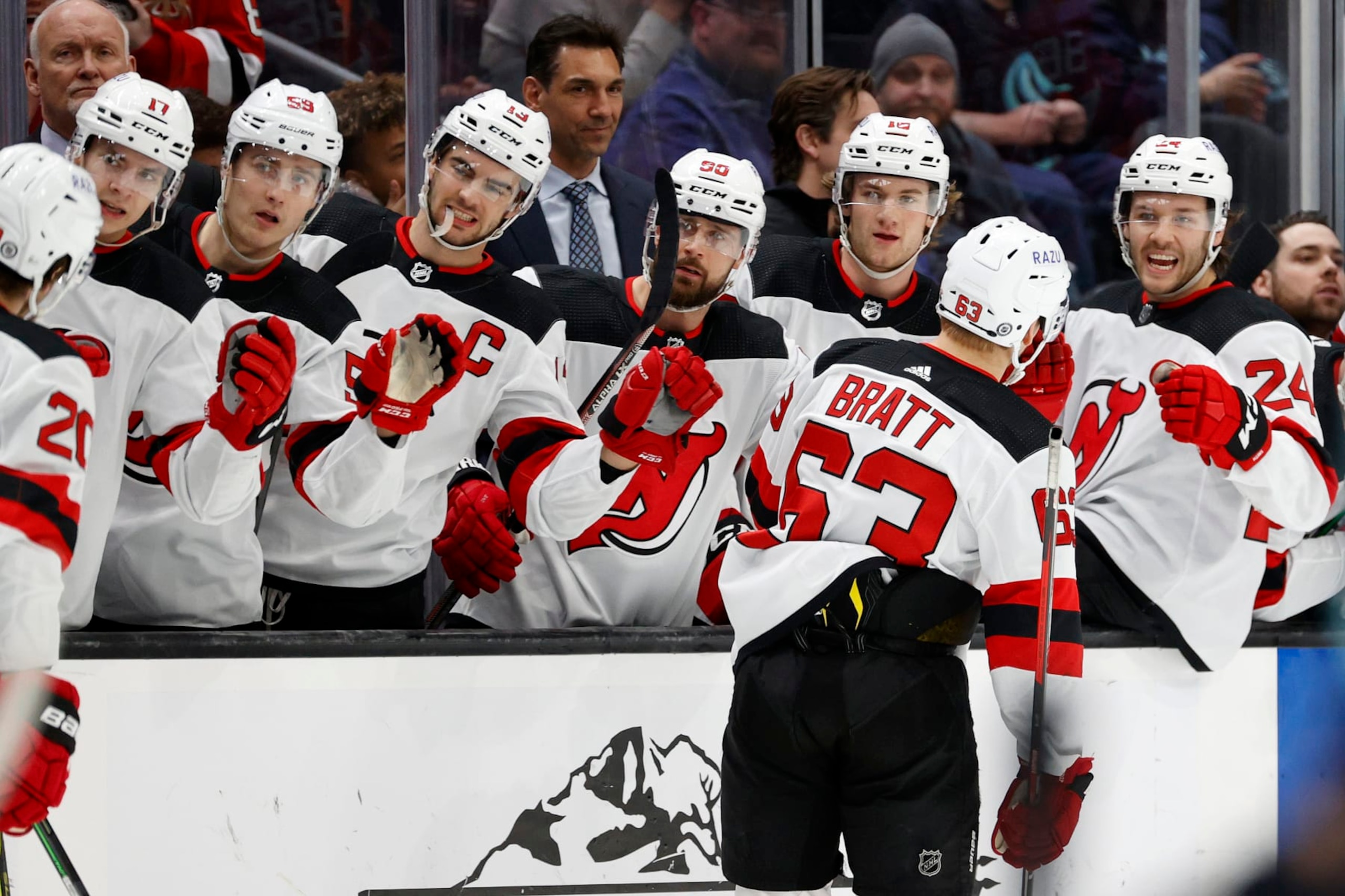 SEATTLE, WASHINGTON - APRIL 16: Jesper Bratt #63 of the New Jersey Devils celebrates his goal with teammates on the bench during the first period against the Seattle Kraken at Climate Pledge Arena on April 16, 2022 in Seattle, Washington. (Photo by Steph Chambers/Getty Images)