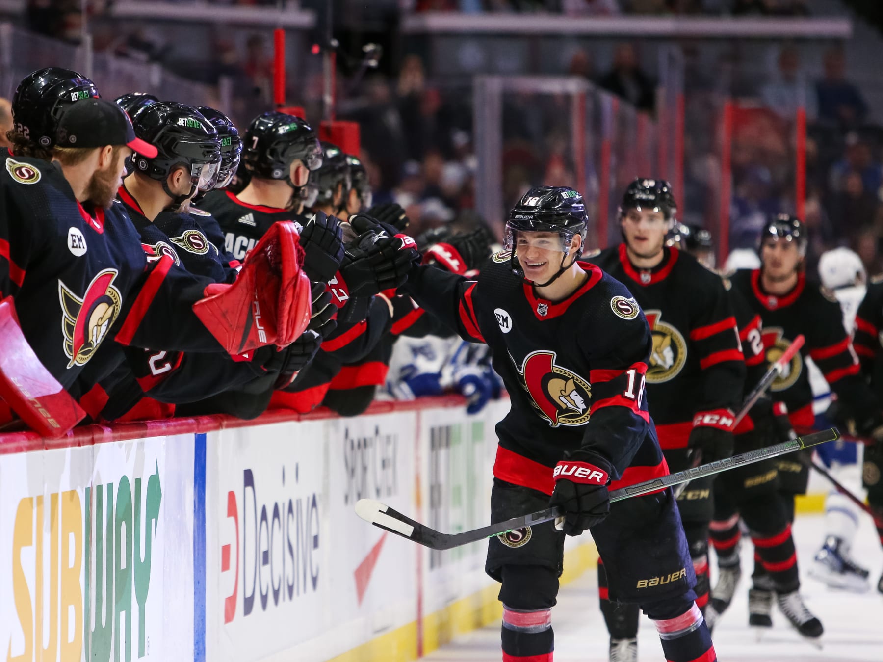 OTTAWA, ONTARIO - APRIL 16: Tim Stützle #18 of the Ottawa Senators celebrates his third period goal against the Toronto Maple Leafs with his teammates on the bench at Canadian Tire Centre on April 16, 2022 in Ottawa, Ontario. (Photo by Chris Tanouye/Getty Images)