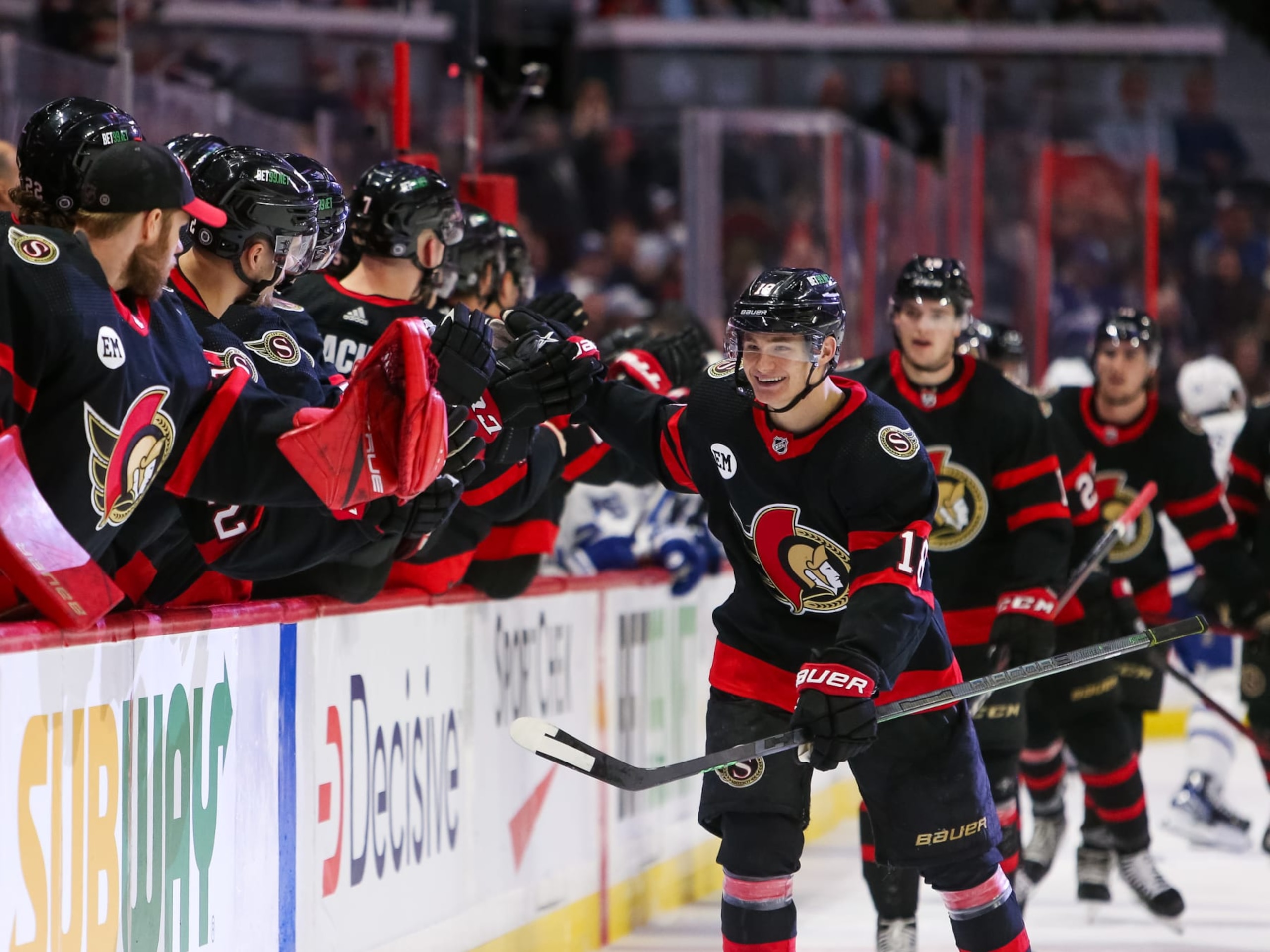 OTTAWA, ONTARIO - APRIL 16: Tim Stützle #18 of the Ottawa Senators celebrates his third period goal against the Toronto Maple Leafs with his teammates on the bench at Canadian Tire Centre on April 16, 2022 in Ottawa, Ontario. (Photo by Chris Tanouye/Getty Images)