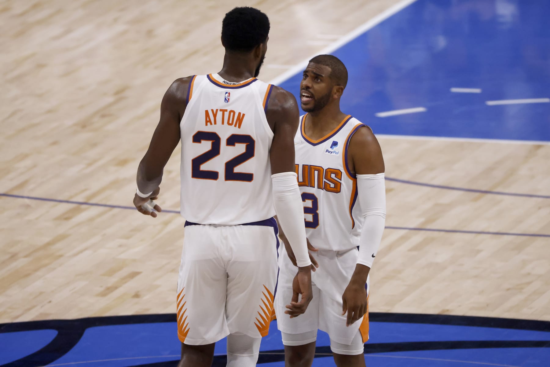 DALLAS, TEXAS - MAY 12: Chris Paul #3 of the Phoenix Suns talks with Deandre Ayton #22 of the Phoenix Suns while taking on the Dallas Mavericks in the first quarter of Game Six of the 2022 NBA Playoffs Western Conference Semifinals at American Airlines Center on May 12, 2022 in Dallas, Texas. NOTE TO USER: User expressly acknowledges and agrees that, by downloading and/or using this photograph, User is consenting to the terms and conditions of the Getty Images License Agreement. (Photo by Ron Jenkins/Getty Images)