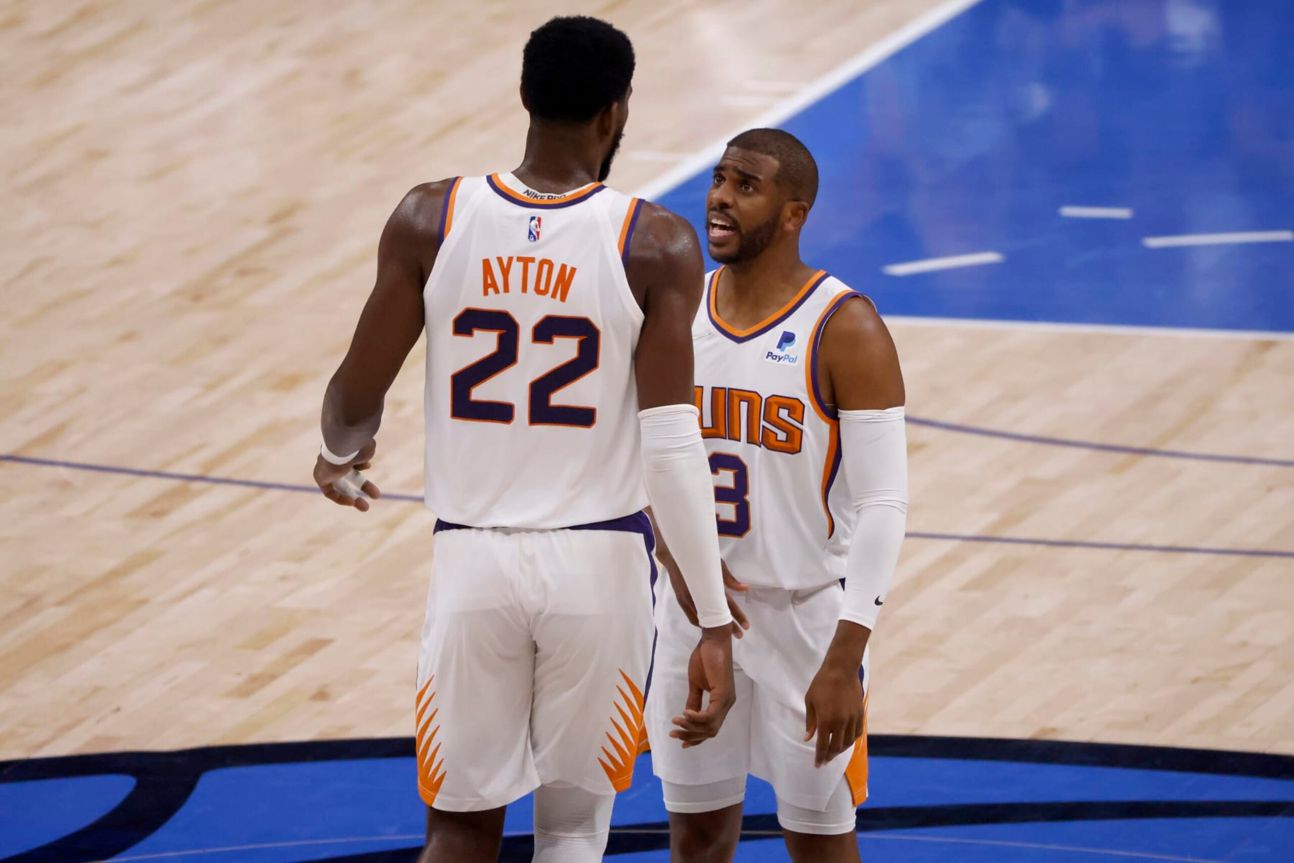 DALLAS, TEXAS - MAY 12: Chris Paul #3 of the Phoenix Suns talks with Deandre Ayton #22 of the Phoenix Suns while taking on the Dallas Mavericks in the first quarter of Game Six of the 2022 NBA Playoffs Western Conference Semifinals at American Airlines Center on May 12, 2022 in Dallas, Texas. NOTE TO USER: User expressly acknowledges and agrees that, by downloading and/or using this photograph, User is consenting to the terms and conditions of the Getty Images License Agreement. (Photo by Ron Jenkins/Getty Images)