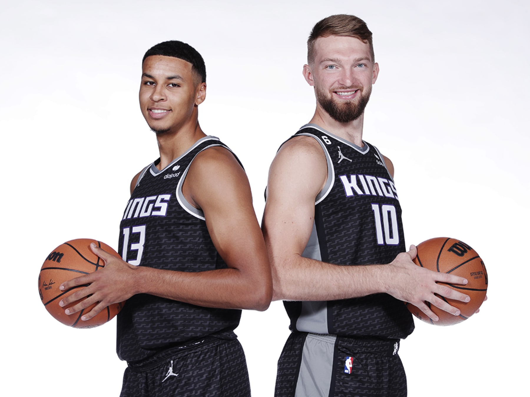 SACRAMENTO, CA - SEPTEMBER 26: Keegan Murray #13 and Domantas Sabonis #10 of the Sacramento Kings poses for a portrait during NBA Media Day on September 26, 2022 at the Golden 1 Center in Sacramento, California. NOTE TO USER: User expressly acknowledges and agrees that, by downloading and/or using this Photograph, user is consenting to the terms and conditions of the Getty Images License Agreement. Mandatory Copyright Notice: Copyright 2022 NBAE (Photo by Rocky Widner/NBAE via Getty Images)