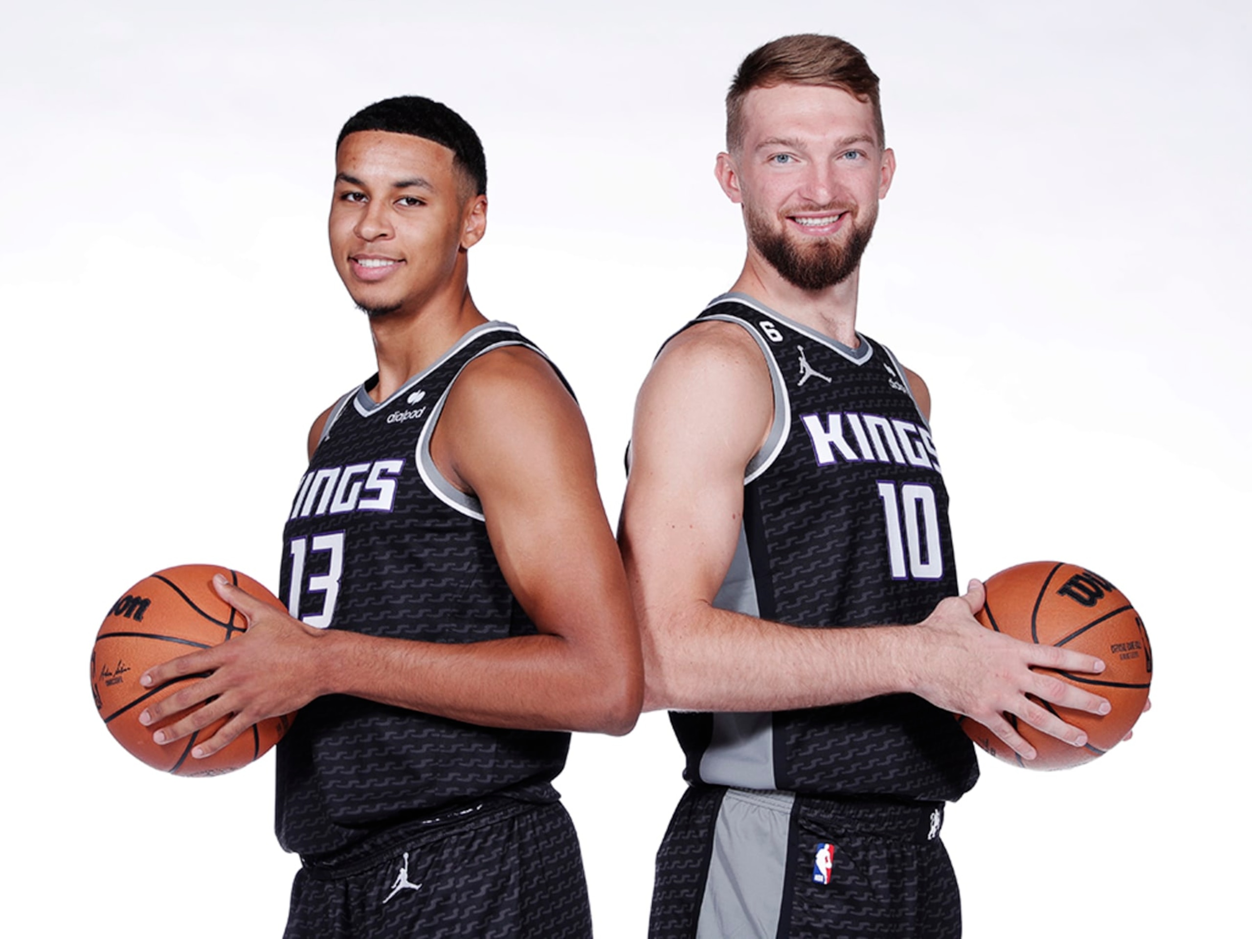 SACRAMENTO, CA - SEPTEMBER 26: Keegan Murray #13 and Domantas Sabonis #10 of the Sacramento Kings poses for a portrait during NBA Media Day on September 26, 2022 at the Golden 1 Center in Sacramento, California. NOTE TO USER: User expressly acknowledges and agrees that, by downloading and/or using this Photograph, user is consenting to the terms and conditions of the Getty Images License Agreement. Mandatory Copyright Notice: Copyright 2022 NBAE (Photo by Rocky Widner/NBAE via Getty Images)