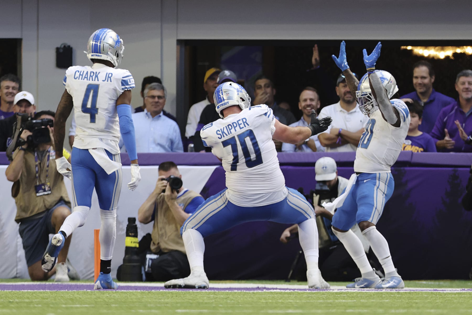 Detroit Lions running back Jamaal Williams (30) celebrates in the end zone after scoring a touchdown against the Minnesota Vikings during the second half of an NFL football game, Sunday, Sept. 25, 2022 in Minneapolis. Williams received an unsportsmanlike conduct penalty after the touchdown. (AP Photo/Stacy Bengs)