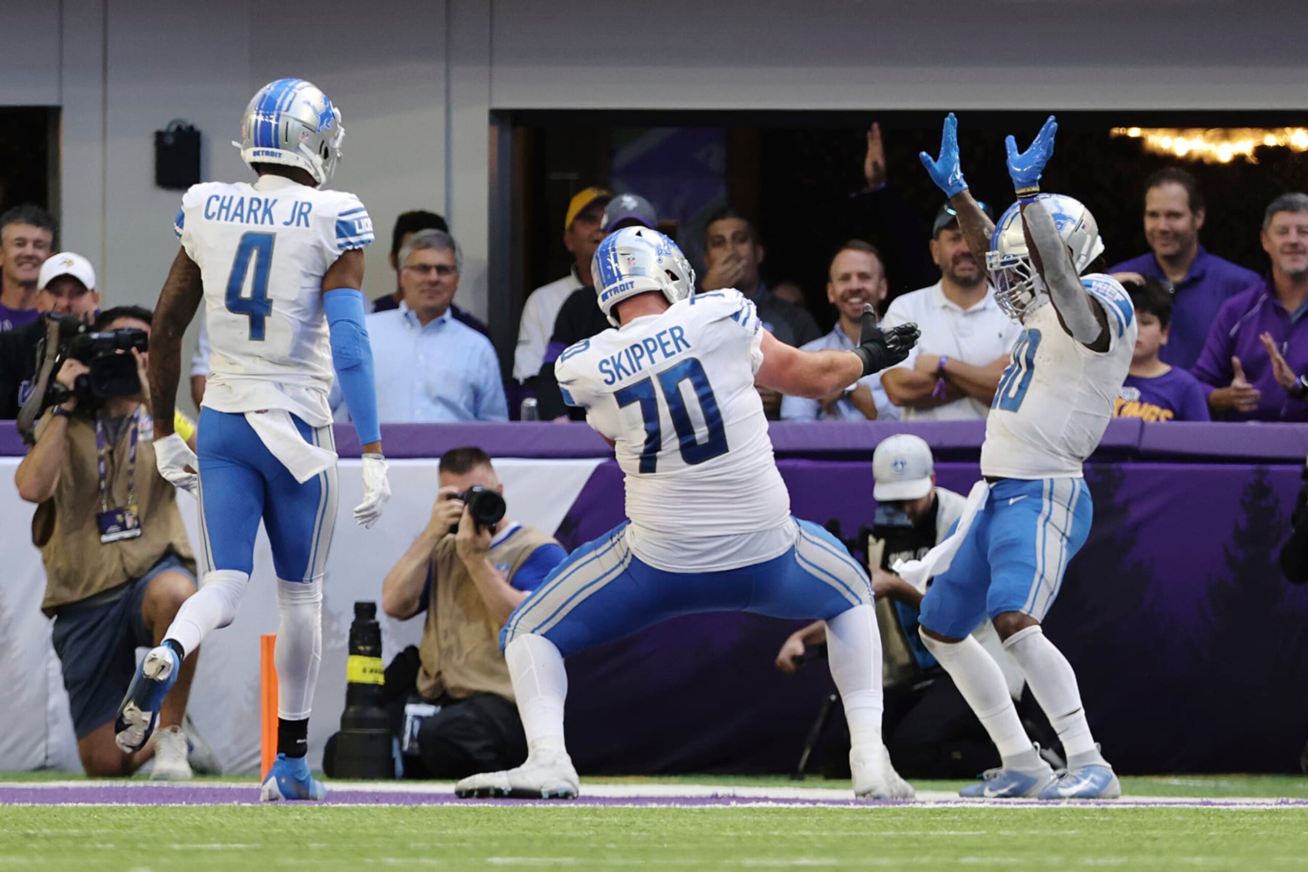 Detroit Lions running back Jamaal Williams (30) celebrates in the end zone after scoring a touchdown against the Minnesota Vikings during the second half of an NFL football game, Sunday, Sept. 25, 2022 in Minneapolis. Williams received an unsportsmanlike conduct penalty after the touchdown. (AP Photo/Stacy Bengs)