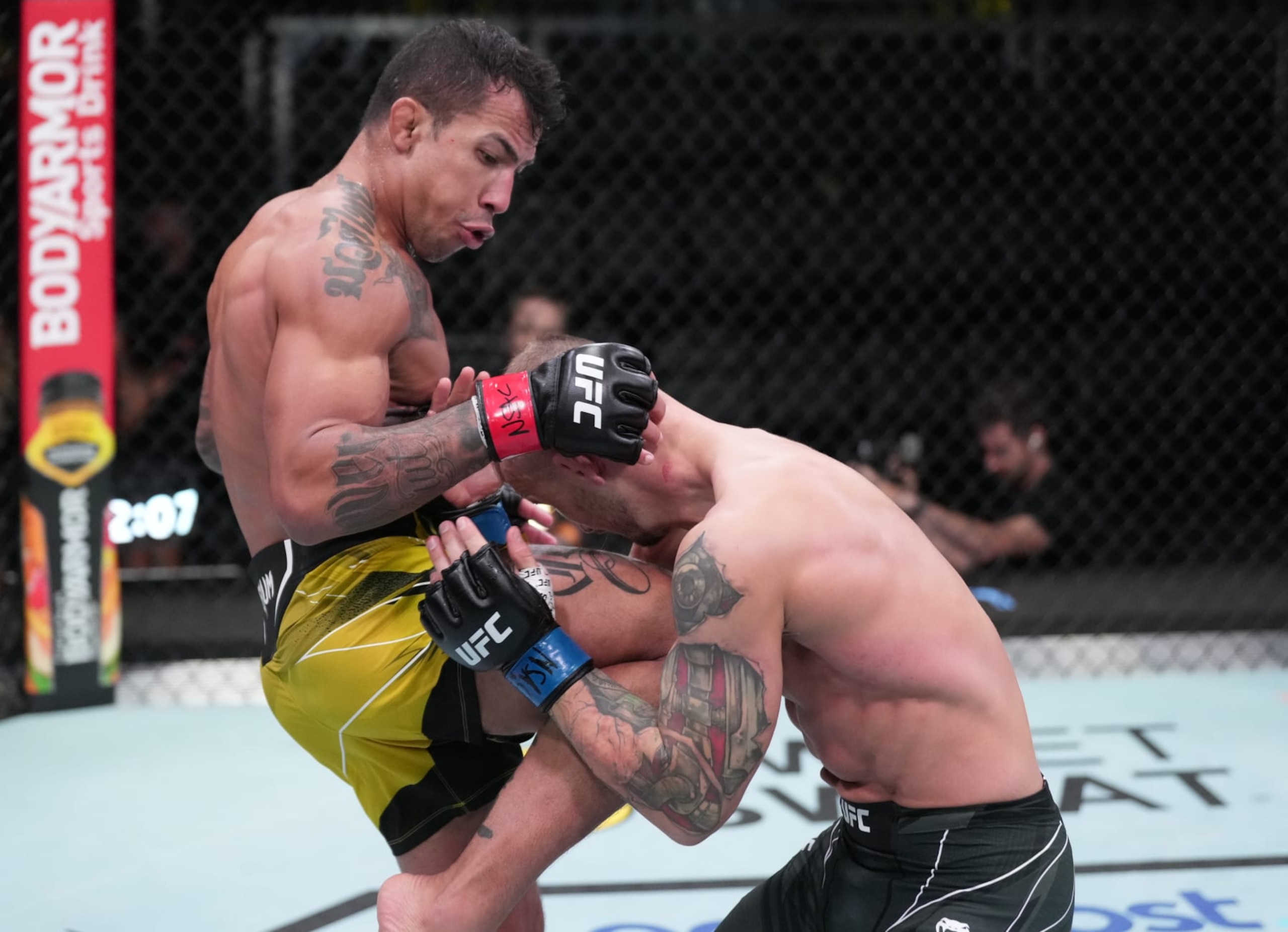 LAS VEGAS, NEVADA - OCTOBER 01: (L-R) Joaquim Silva of Brazil knees Jesse Ronson of Canada in a lightweight fight during the UFC Fight Night event at UFC APEX on October 01, 2022 in Las Vegas, Nevada. (Photo by Jeff Bottari/Zuffa LLC)