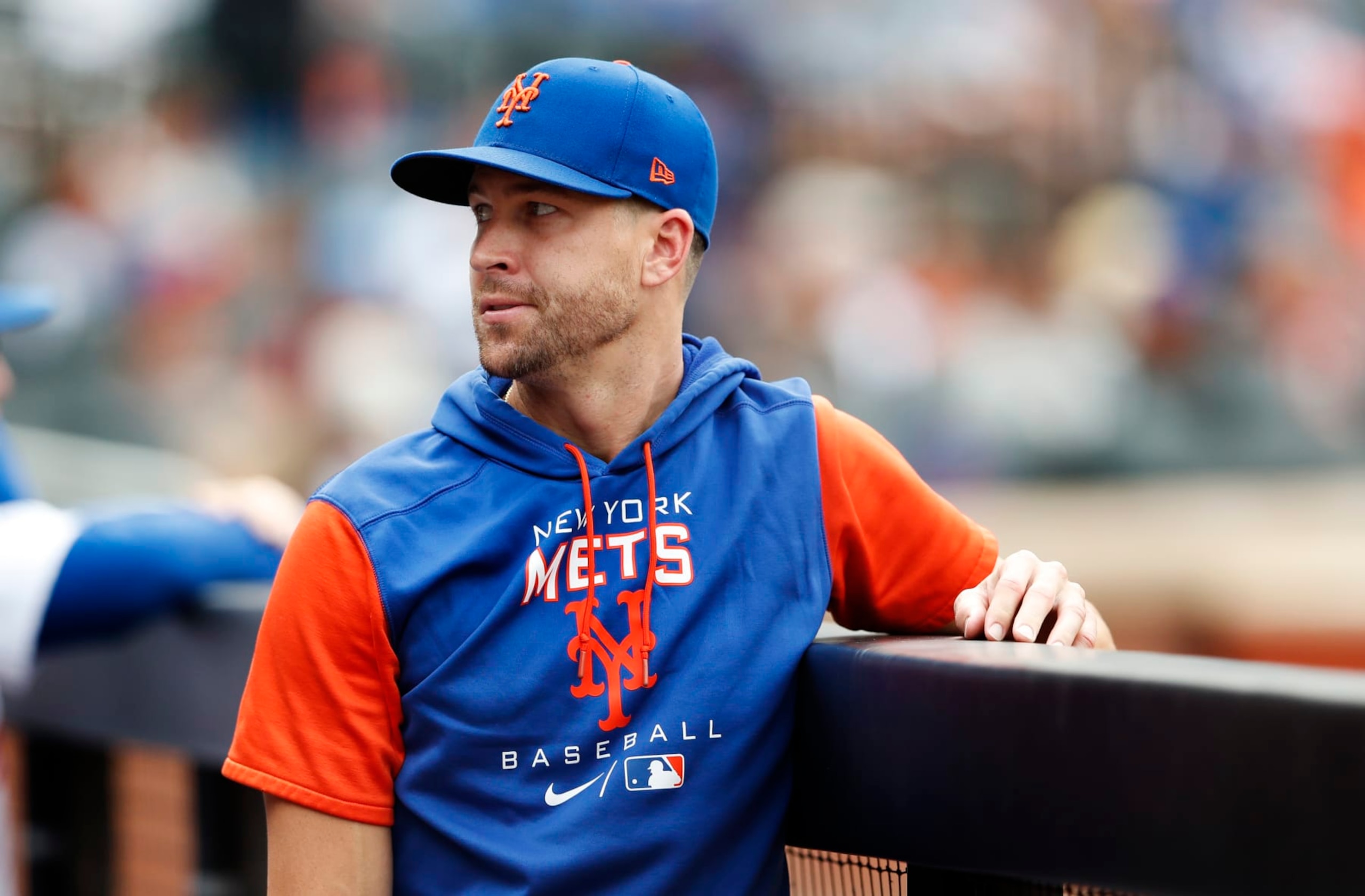 New York Mets pitcher Jacob deGrom ooks on in the dugout during the seventh inning of a baseball game against the Washington Nationals, Sunday, Sept. 4, 2022, in New York. (AP Photo/Noah K. Murray)