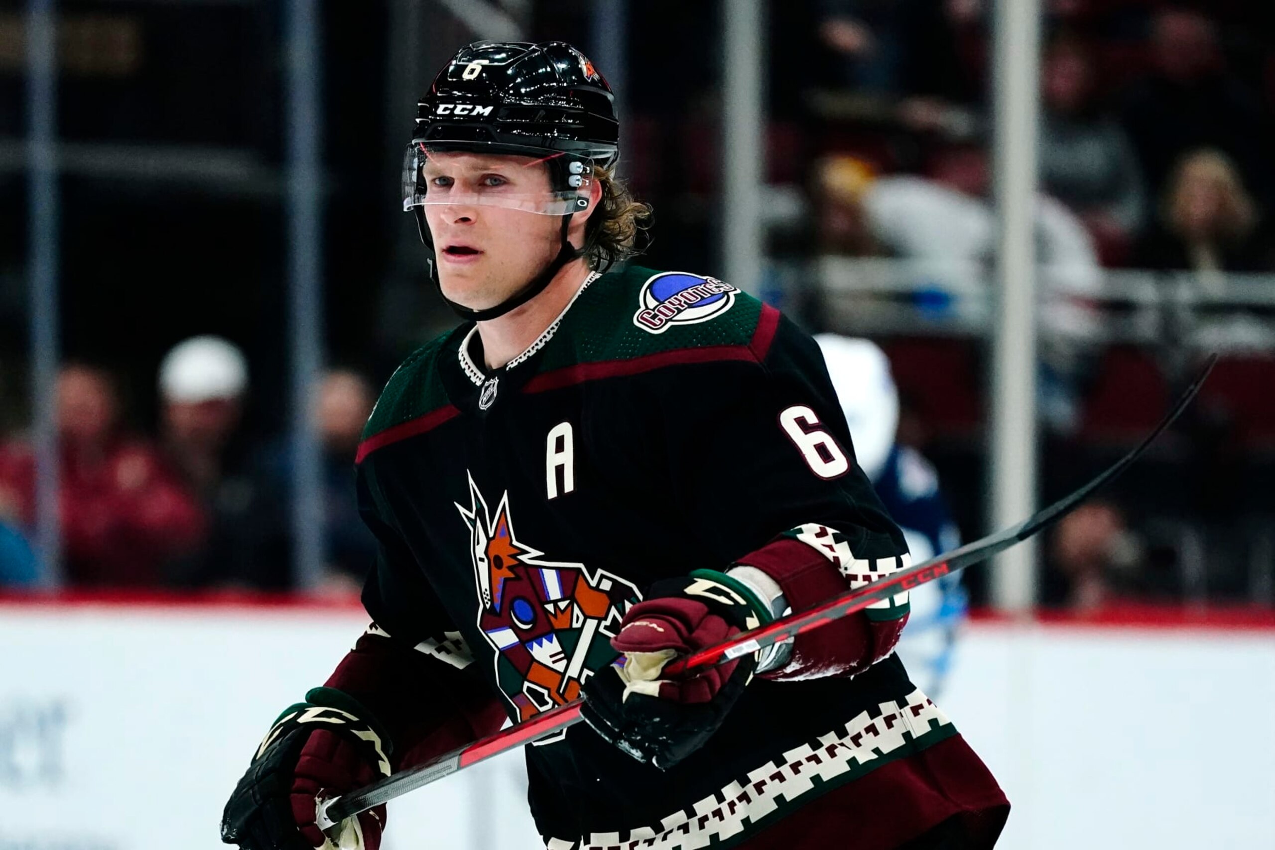 Arizona Coyotes defenseman Jakob Chychrun watches the puck during the second period of an NHL hockey game against the Winnipeg Jets Sunday, Feb. 27, 2022, in Glendale, Ariz. (AP Photo/Ross D. Franklin)