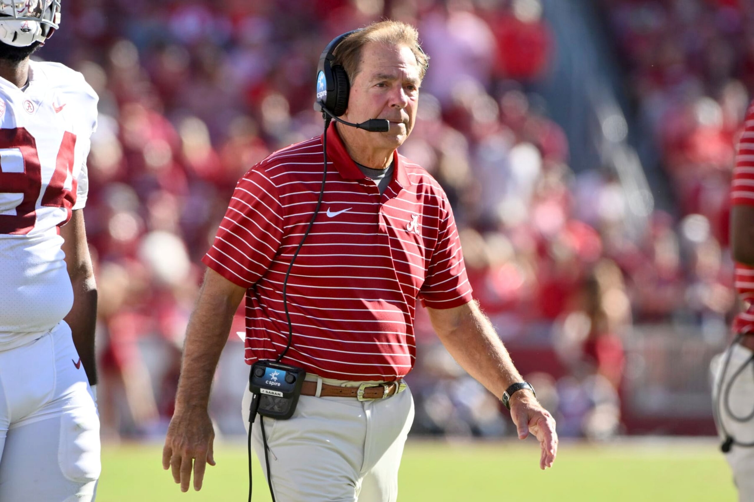 Alabama coach Nick Saban walks out to talk to his team during a time out against Arkansas during the first half of an NCAA college football game Saturday, Oct. 1, 2022, in Fayetteville, Ark. (AP Photo/Michael Woods)