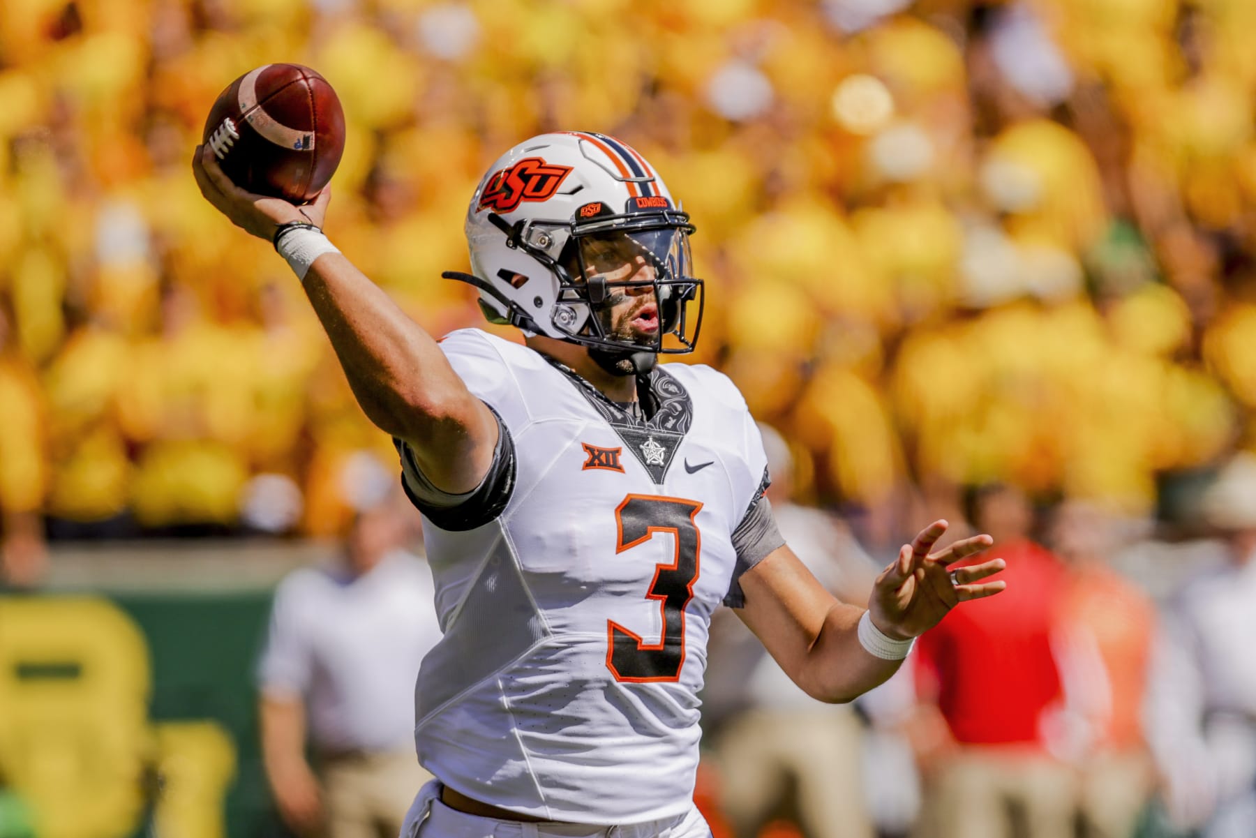 Oklahoma State quarterback Spencer Sanders (3) throws down the field during the first half of an NCAA college football game against Baylor in Waco, Texas, Saturday, Oct. 1, 2022. (AP Photo/Gareth Patterson)