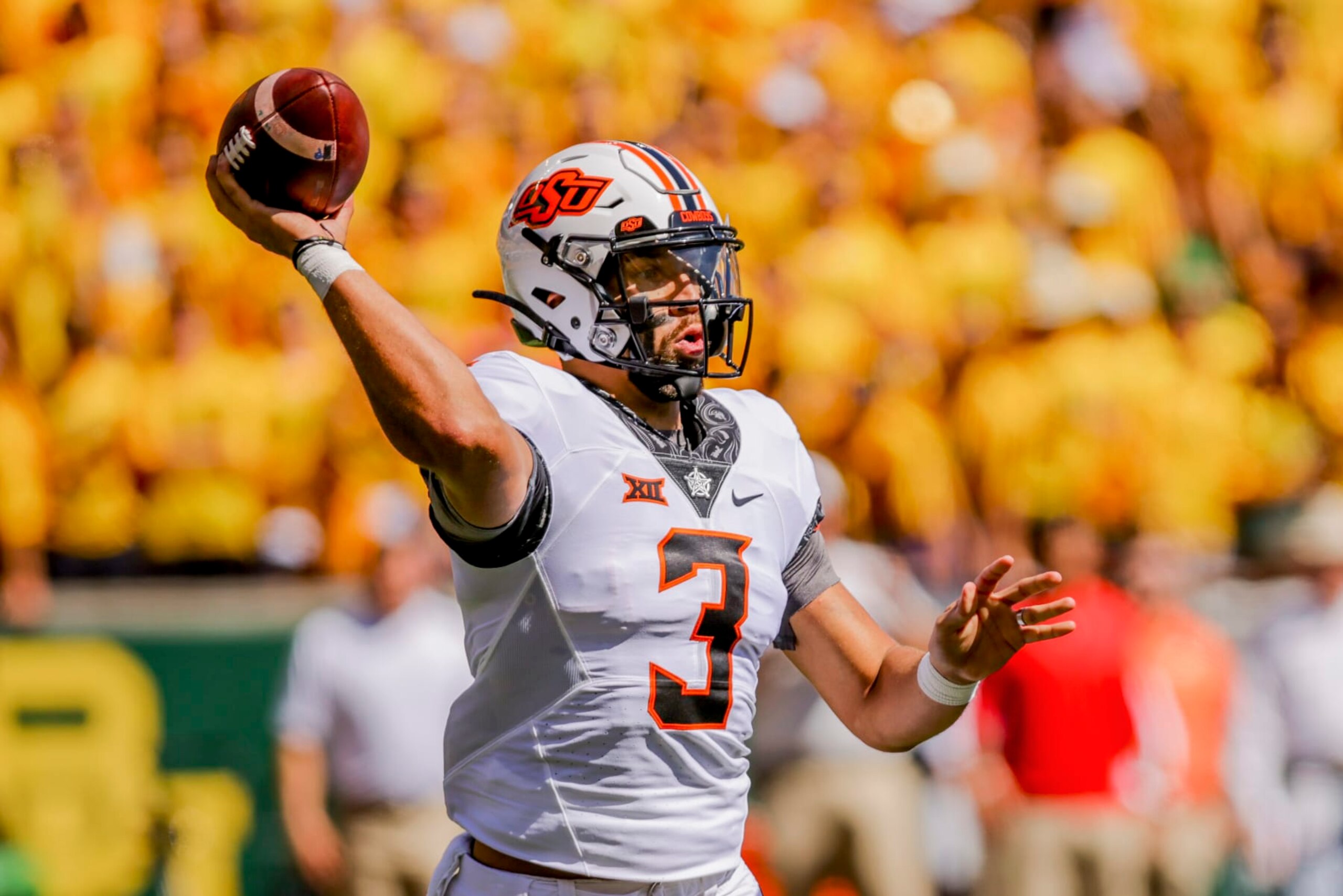 Oklahoma State quarterback Spencer Sanders (3) throws down the field during the first half of an NCAA college football game against Baylor in Waco, Texas, Saturday, Oct. 1, 2022. (AP Photo/Gareth Patterson)