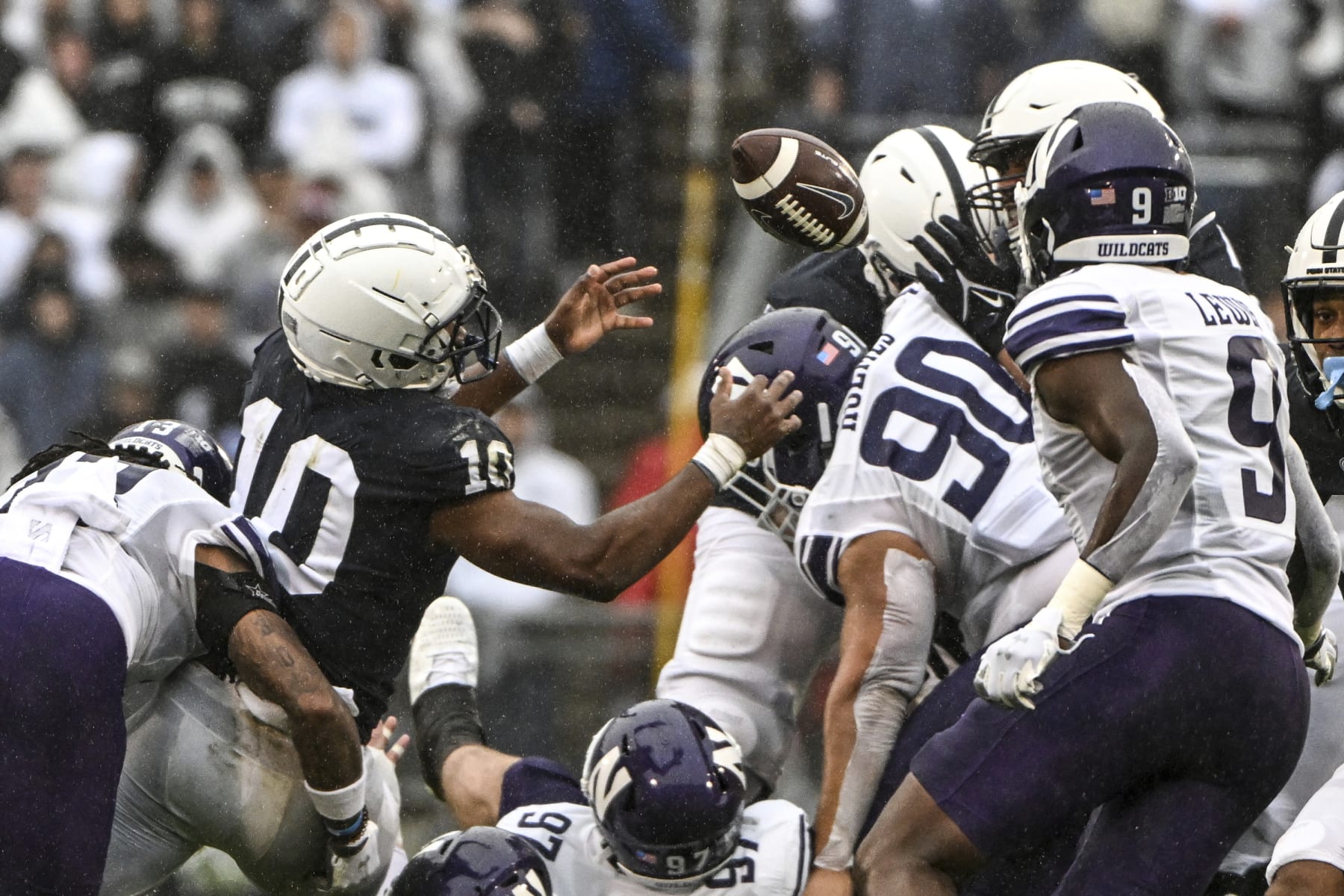 Penn State running back Nicholas Singleton (10) fumbles the ball against Northwestern during the first half of an NCAA college football game, Saturday, Oct. 1, 2022, in State College, Pa. (AP Photo/Barry Reeger)