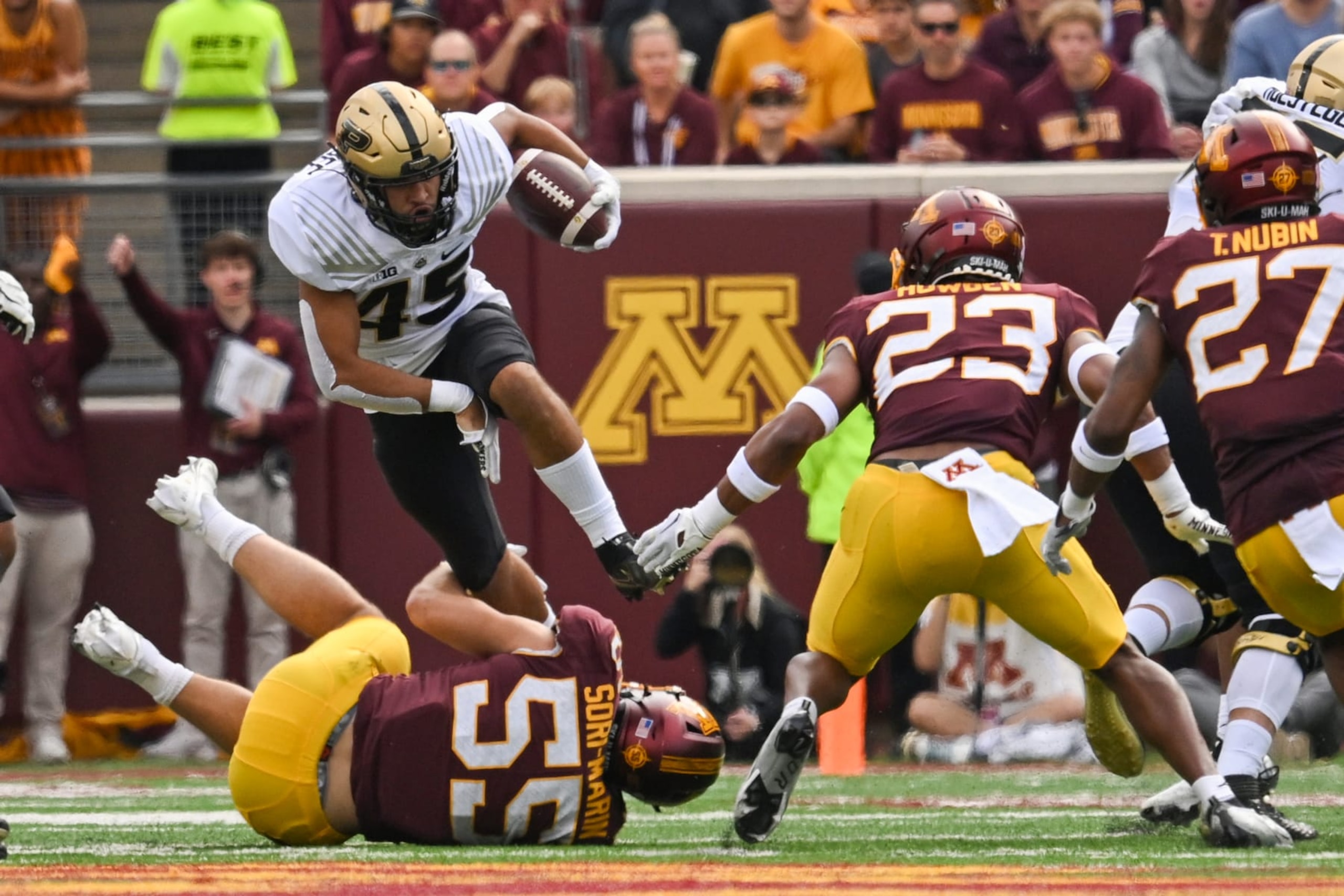 MINNEAPOLIS, MN - OCTOBER 01: Purdue Boilermakers running back Devin Mockobee (45) leaps over Minnesota Golden Gophers linebacker Mariano Sori-Marin (55) during the first half of a college football game between the Minnesota Golden Gophers and Purdue Boilermakers on October 1, 2022 at Huntington Bank Stadium in Minneapolis, MN.(Photo by Nick Wosika/Icon Sportswire via Getty Images)