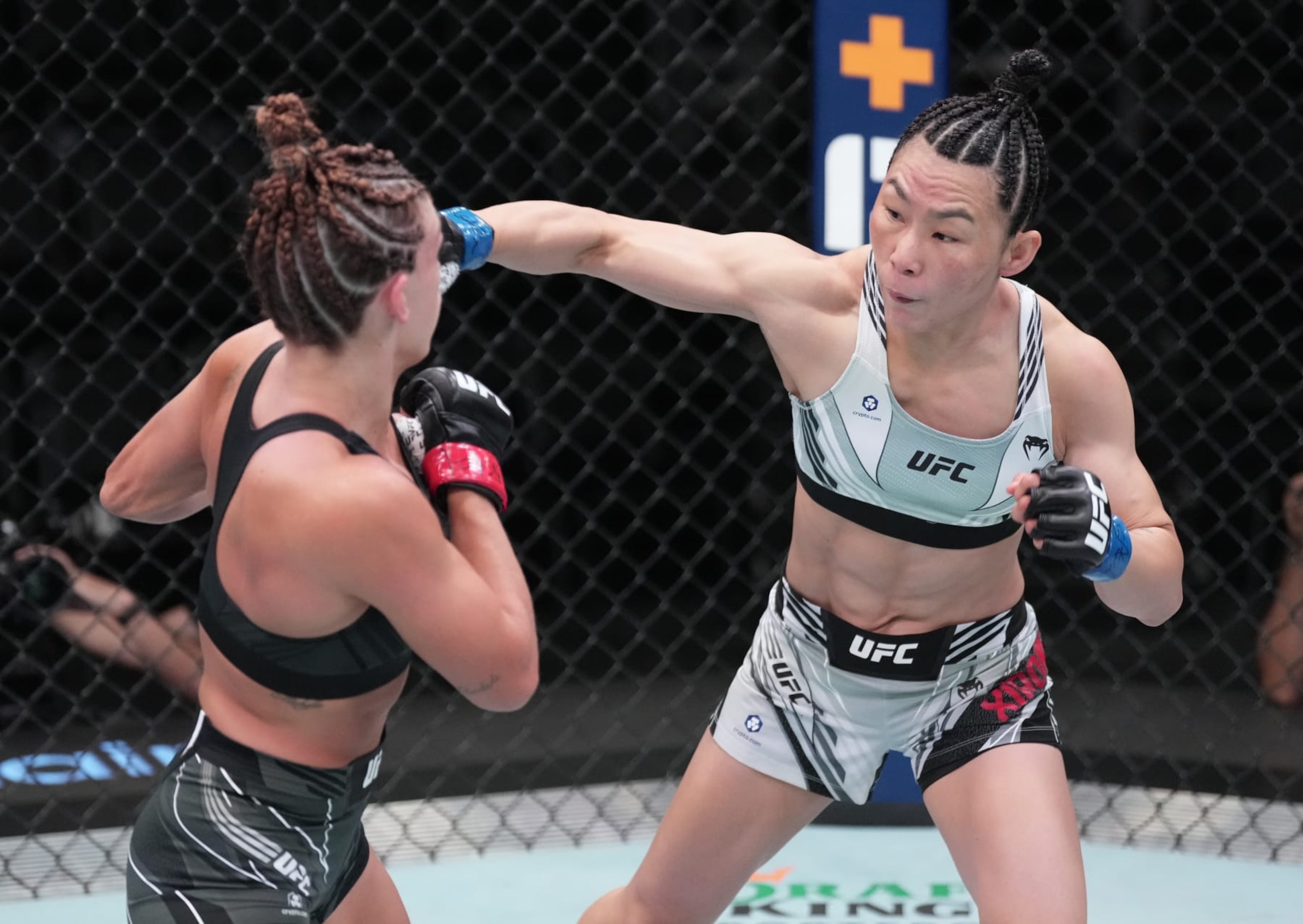 LAS VEGAS, NEVADA - OCTOBER 01: (R-L) Yan Xiaonan of China punches Mackenzie Dern in a strawweight fight during the UFC Fight Night event at UFC APEX on October 01, 2022 in Las Vegas, Nevada. (Photo by Jeff Bottari/Zuffa LLC) LAS VEGAS, NEVADA - OCTOBER 01: (R-L) Yan Xiaonan of China punches Mackenzie Dern in a strawweight fight during the UFC Fight Night event at UFC APEX on October 01, 2022 in Las Vegas, Nevada. (Photo by Jeff Bottari/Zuffa LLC)