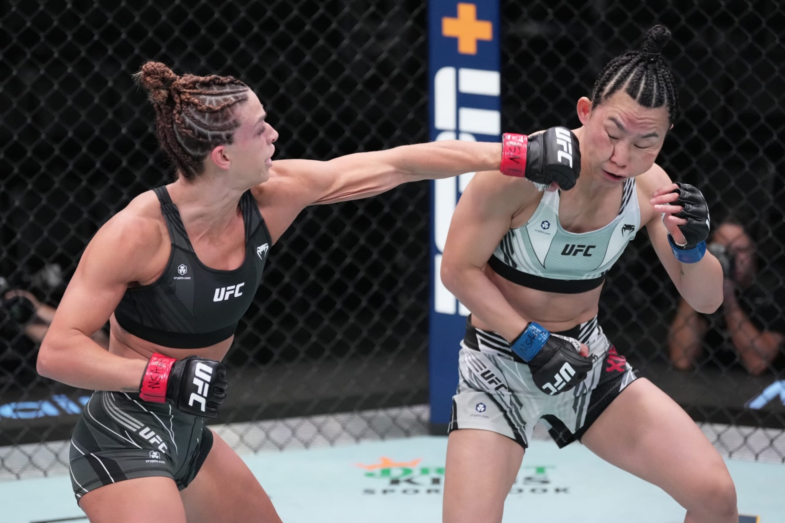 LAS VEGAS, NEVADA - OCTOBER 01: (L-R) Mackenzie Dern punches Yan Xiaonan of China in a strawweight fight during the UFC Fight Night event at UFC APEX on October 01, 2022 in Las Vegas, Nevada. (Photo by Jeff Bottari/Zuffa LLC) LAS VEGAS, NEVADA - OCTOBER 01: (L-R) Mackenzie Dern punches Yan Xiaonan of China in a strawweight fight during the UFC Fight Night event at UFC APEX on October 01, 2022 in Las Vegas, Nevada. (Photo by Jeff Bottari/Zuffa LLC)