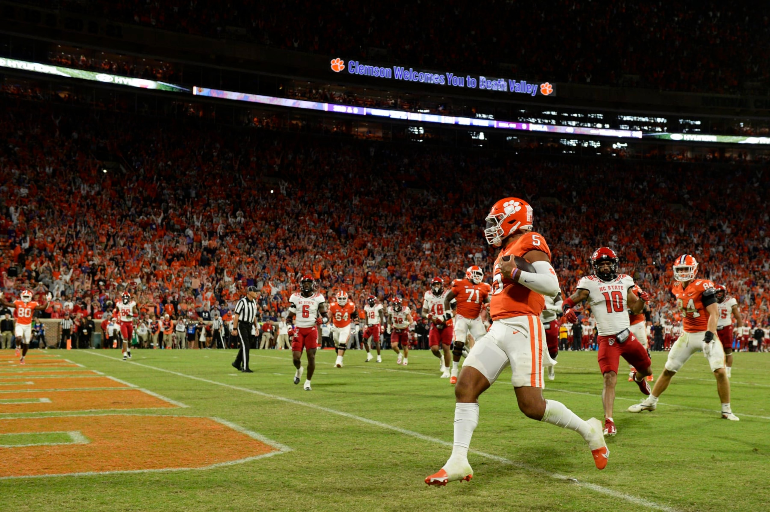 CLEMSON, SOUTH CAROLINA - OCTOBER 01: DJ Uiagalelei #5 of the Clemson Tigers scores a fourth quarter touchdown against the North Carolina State Wolfpack at Memorial Stadium on October 01, 2022 in Clemson, South Carolina. (Photo by Eakin Howard/Getty Images)