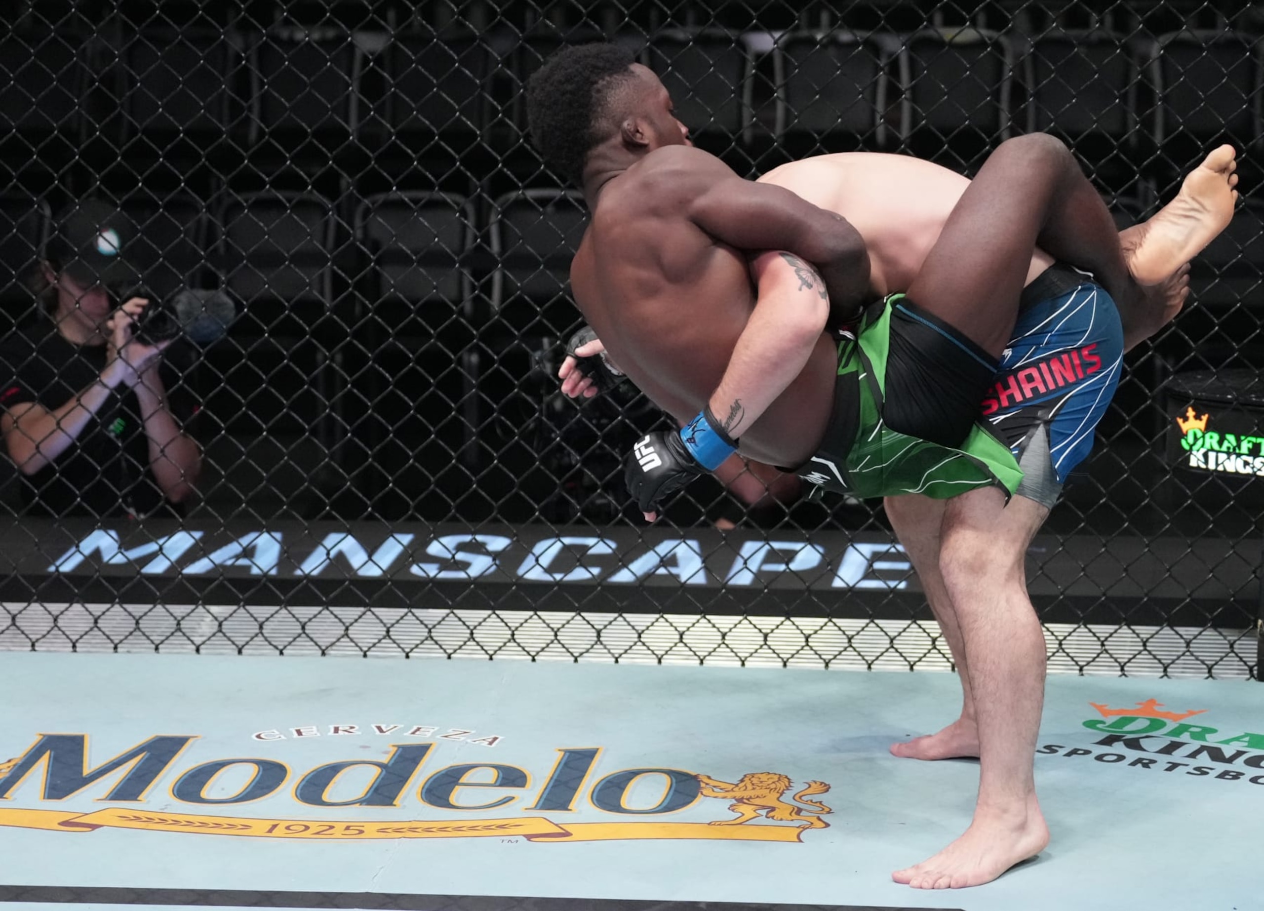 LAS VEGAS, NEVADA - OCTOBER 01: (L-R) Sodiq Yusuff of Nigeria jumps to a guillotine choke against Don Shainis in a featherweight fight during the UFC Fight Night event at UFC APEX on October 01, 2022 in Las Vegas, Nevada. (Photo by Jeff Bottari/Zuffa LLC) LAS VEGAS, NEVADA - OCTOBER 01: (L-R) Sodiq Yusuff of Nigeria jumps to a guillotine choke against Don Shainis in a featherweight fight during the UFC Fight Night event at UFC APEX on October 01, 2022 in Las Vegas, Nevada. (Photo by Jeff Bottari/Zuffa LLC)