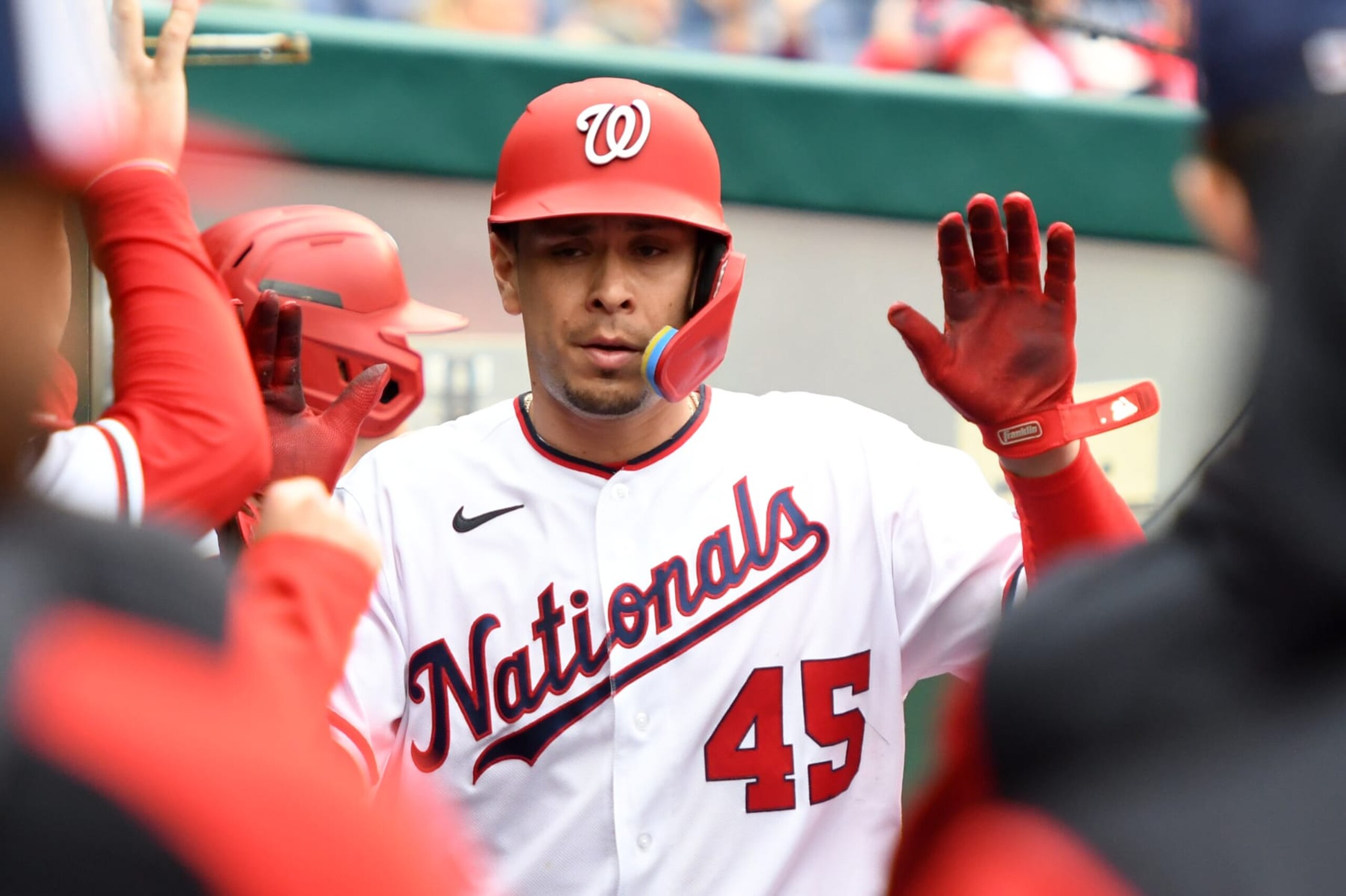 WASHINGTON, DC - OCTOBER 01:  Joey Meneses #45 of the Washington Nationals celebrates scoring a run on a Luis Garcia #2 single in the seventh inning during game one of a doubleheader baseball game against the Philadelphia Phillies at Nationals Park on October 1, 2022 in Washington, DC.  (Photo by Mitchell Layton/Getty Images)