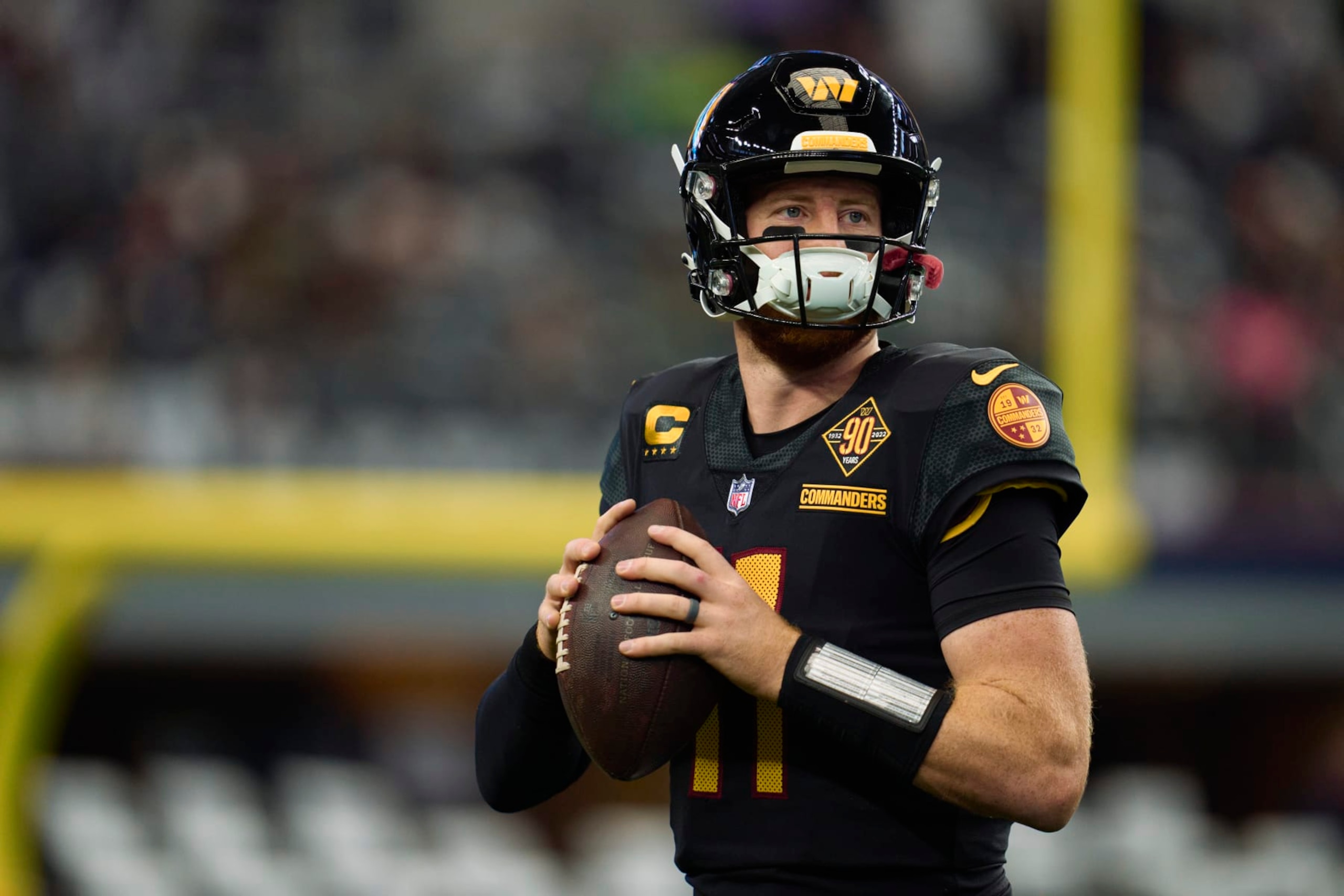 ARLINGTON, TX - OCTOBER 02: Carson Wentz #11 of the Washington Commanders warms up before kickoff against the Dallas Cowboys at AT&T Stadium on October 2, 2022 in Arlington, Texas. (Photo by Cooper Neill/Getty Images)