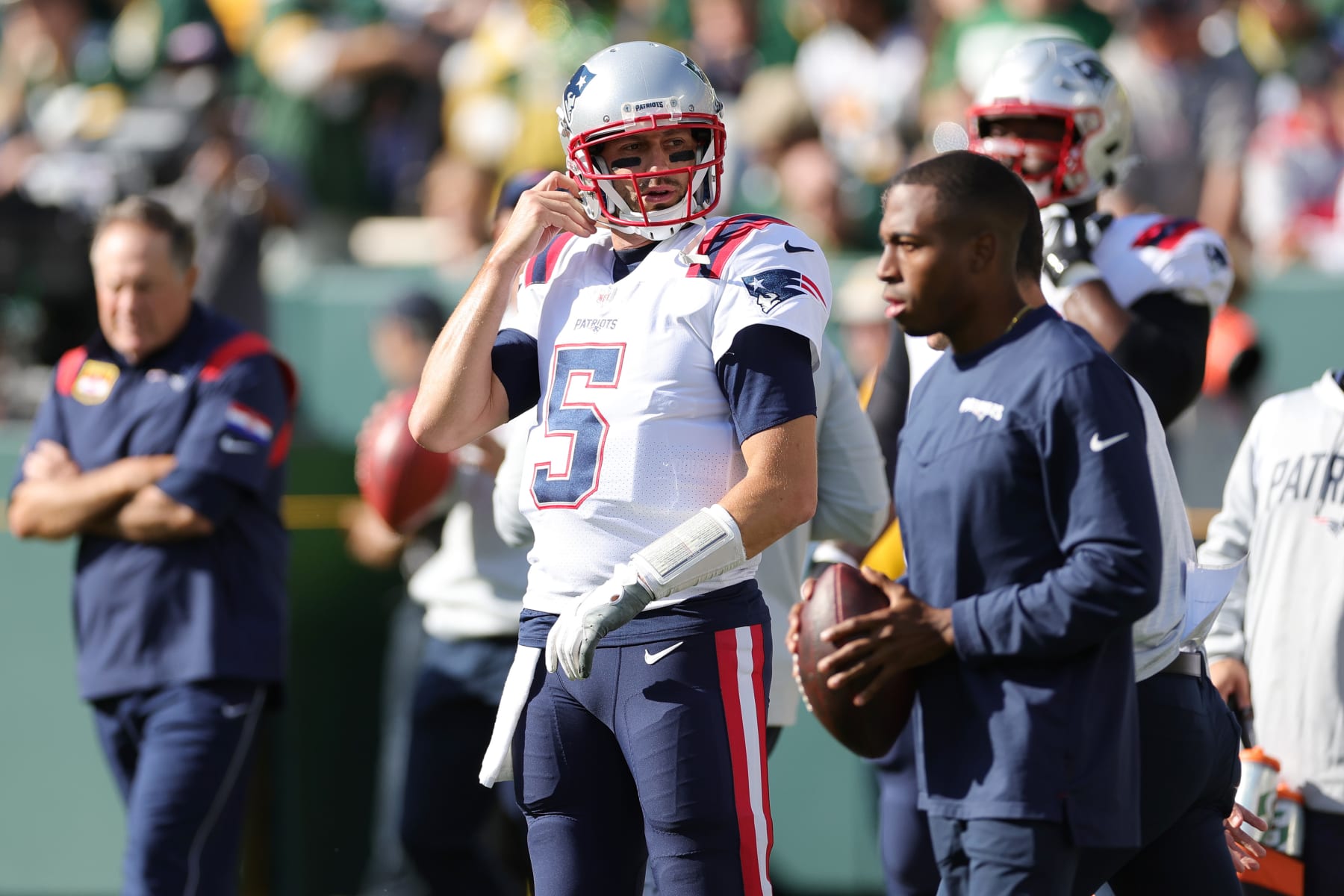 GREEN BAY, WISCONSIN - OCTOBER 02: Brian Hoyer #5 of the New England Patriots looks onward during pregame against the Green Bay Packers at Lambeau Field on October 02, 2022 in Green Bay, Wisconsin. (Photo by Stacy Revere/Getty Images)