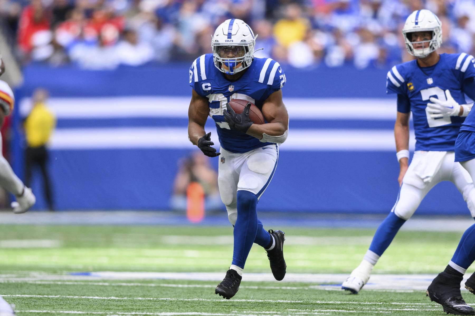 Indianapolis Colts running back Jonathan Taylor (28) runs up the middle during an NFL football game against the Kansas City Chiefs, Sunday, Sept. 25, 2022, in Indianapolis. (AP Photo/Zach Bolinger)