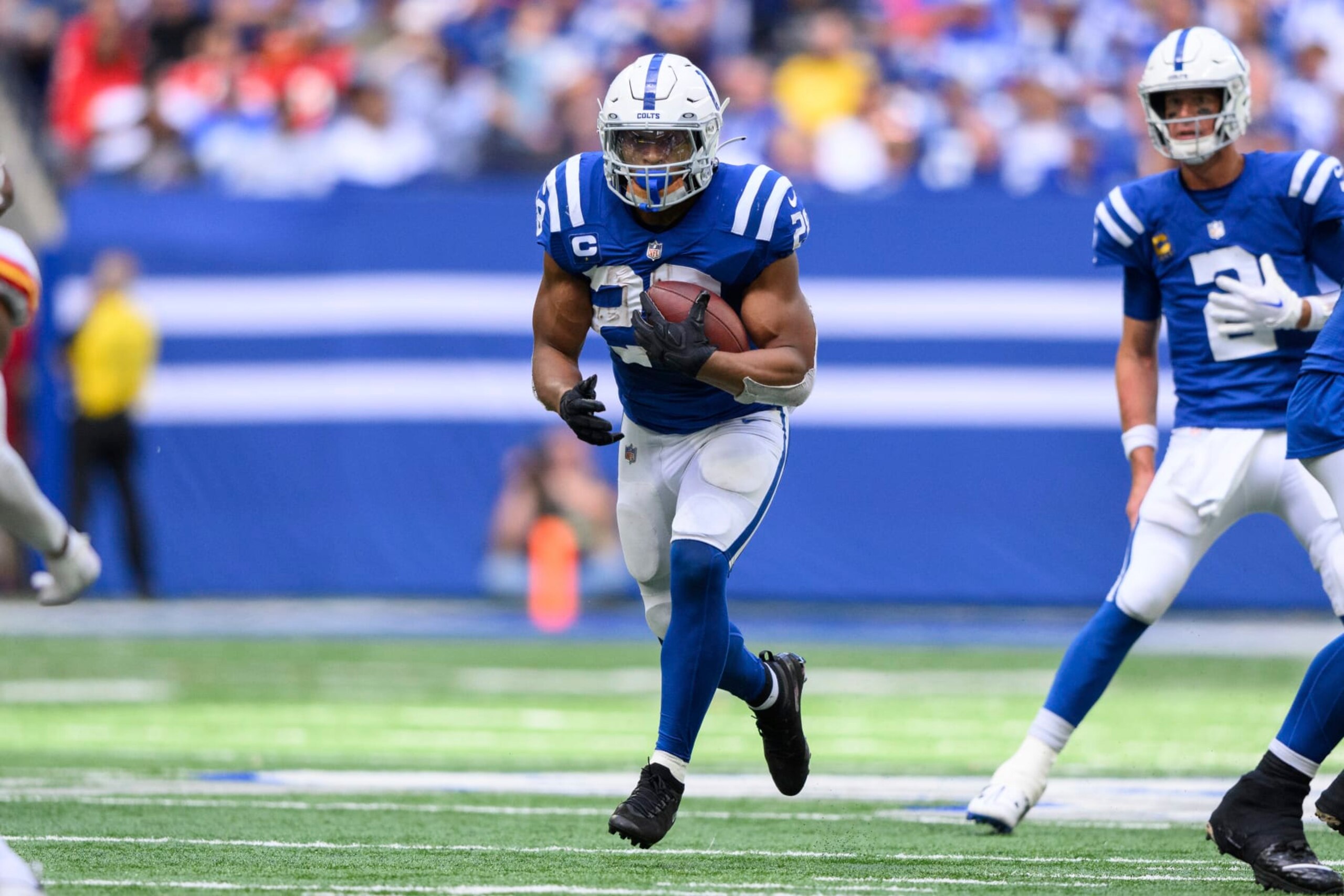 Indianapolis Colts running back Jonathan Taylor (28) runs up the middle during an NFL football game against the Kansas City Chiefs, Sunday, Sept. 25, 2022, in Indianapolis. (AP Photo/Zach Bolinger)