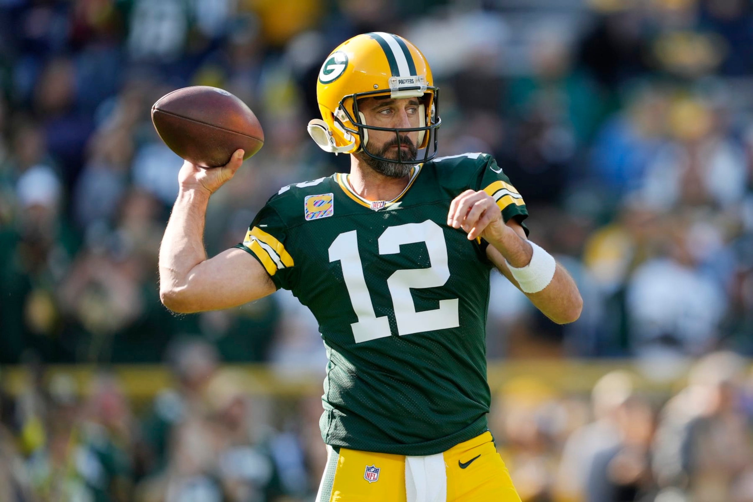 GREEN BAY, WISCONSIN - OCTOBER 02: Aaron Rodgers #12 of the Green Bay Packers warms up before his game against the New England Patriots at Lambeau Field on October 02, 2022 in Green Bay, Wisconsin. (Photo by Patrick McDermott/Getty Images)