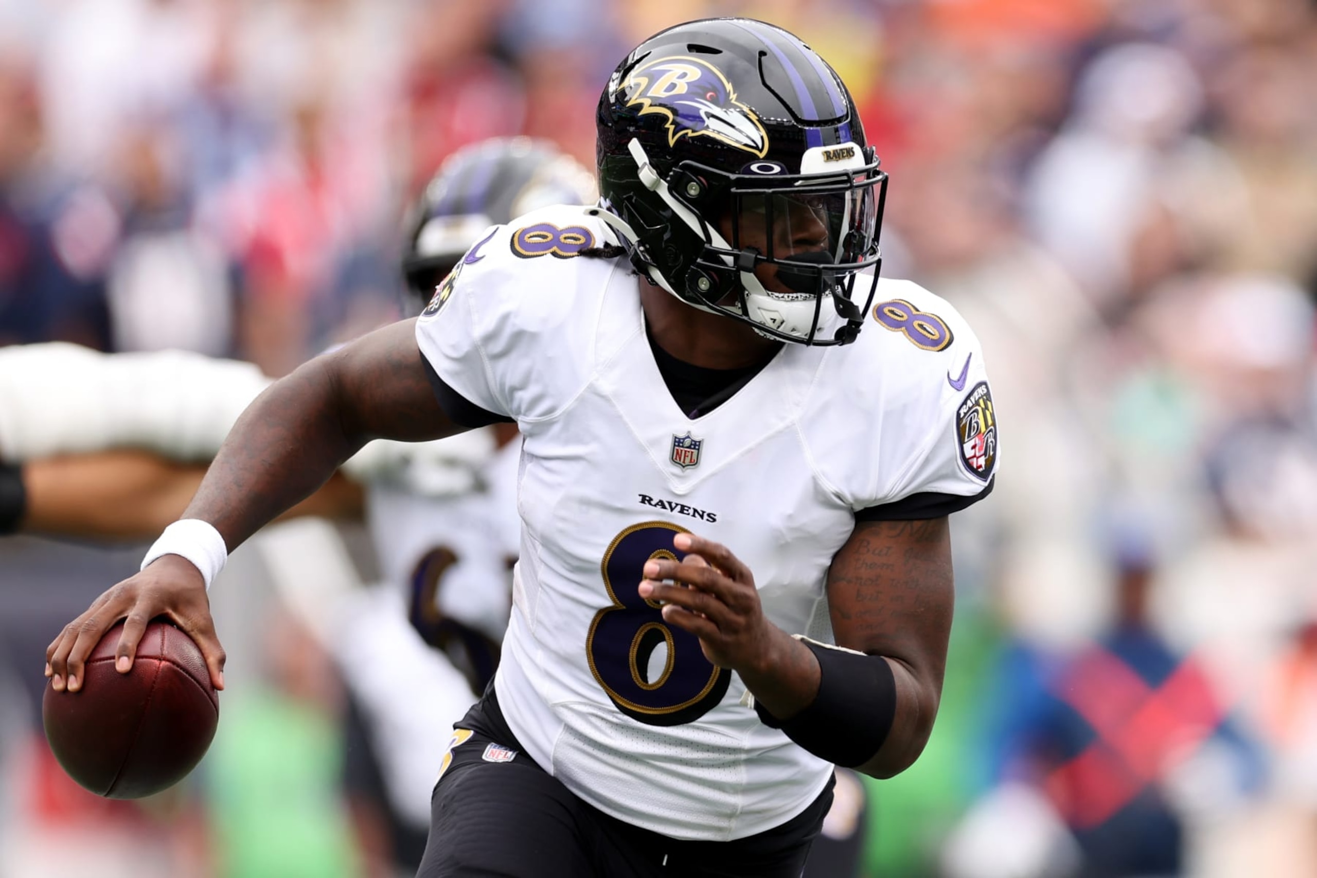 FOXBOROUGH, MASSACHUSETTS - SEPTEMBER 25: Lamar Jackson #8 of the Baltimore Ravens rushes against the New England Patriots at Gillette Stadium on September 25, 2022 in Foxborough, Massachusetts. (Photo by Maddie Meyer/Getty Images)