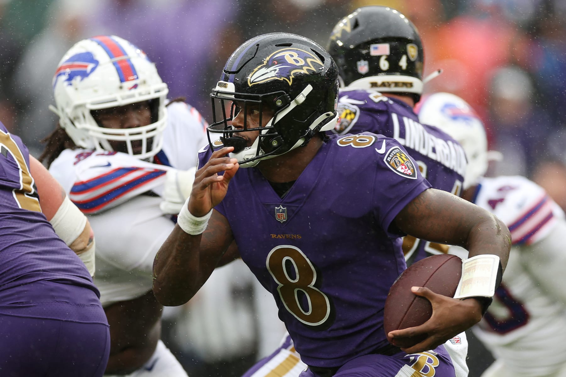 BALTIMORE, MARYLAND - OCTOBER 02: Lamar Jackson #8 of the Baltimore Ravens runs with the ball in the fourth quarter against the Buffalo Bills at M&T Bank Stadium on October 02, 2022 in Baltimore, Maryland. (Photo by Rob Carr/Getty Images)