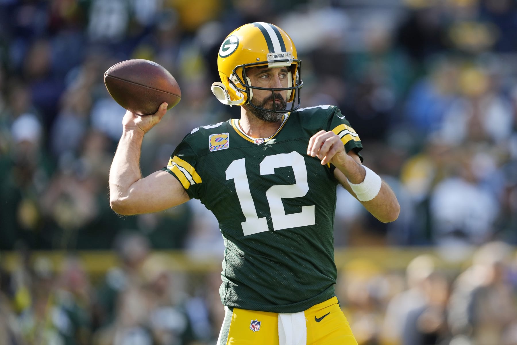 GREEN BAY, WISCONSIN - OCTOBER 02: Aaron Rodgers #12 of the Green Bay Packers warms up before his game against the New England Patriots at Lambeau Field on October 02, 2022 in Green Bay, Wisconsin. (Photo by Patrick McDermott/Getty Images)