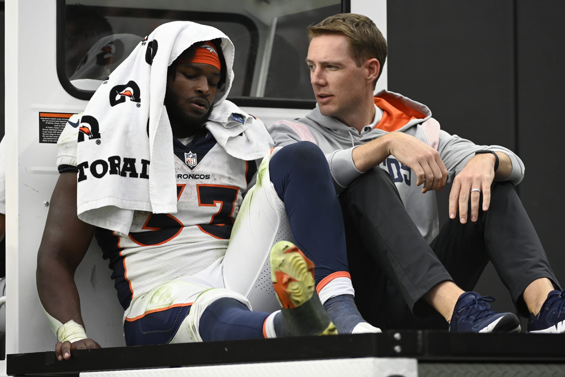 Denver Broncos running back Javonte Williams (33) is cartted off the field during the second half of an NFL football game against theLas Vegas Raiders, Sunday, Oct. 2, 2022, in Las Vegas. (AP Photo/David Becker)